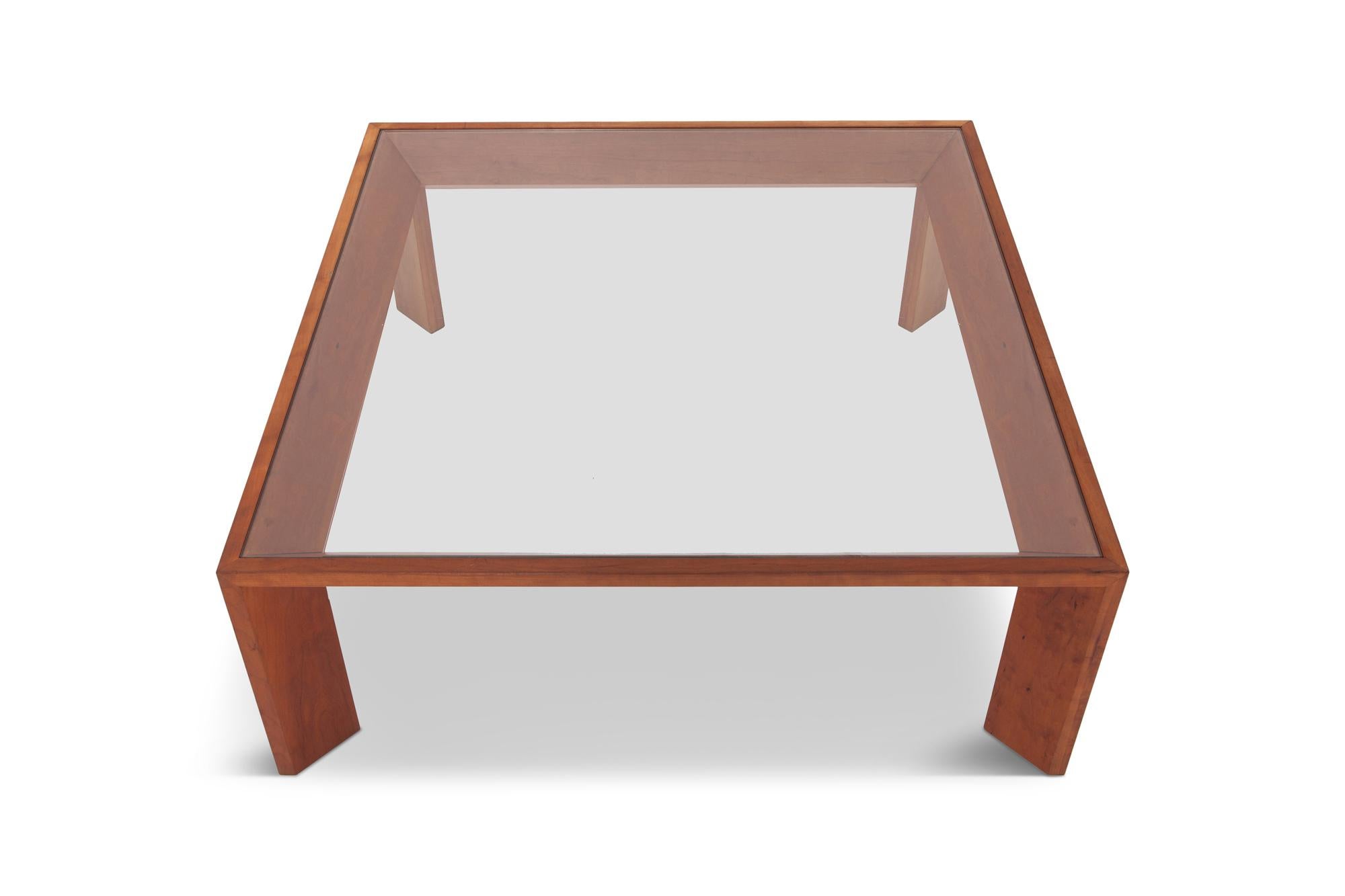 Jean Royere style square coffee table with glass top. This piece was much ahead of it’s time, a very architectural piece for 1935 France. The Elm frame has been put together in quite an ingenious fashion with beautiful corners and joints. A very