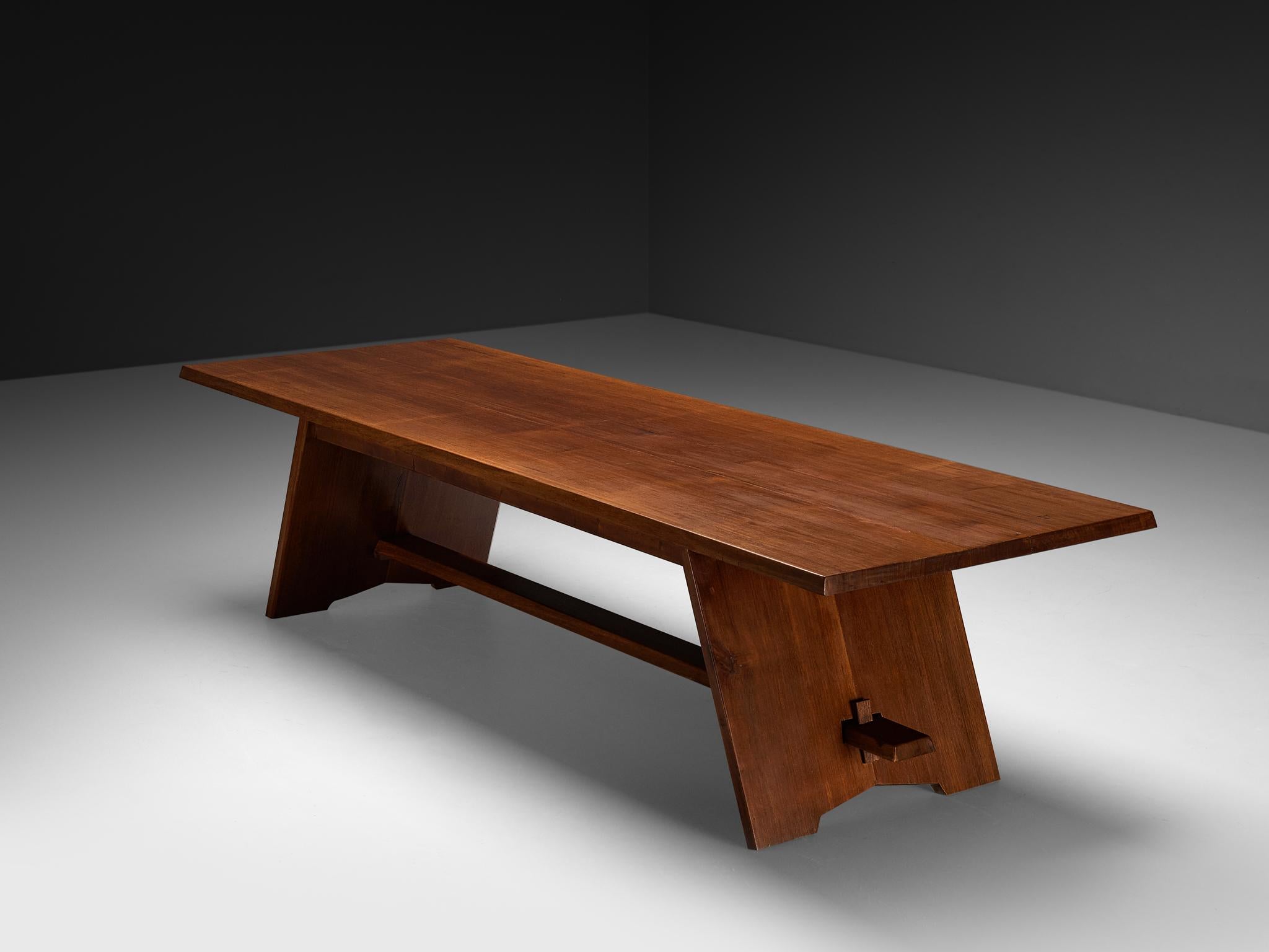 Table, meranti, France, 1960s

A striking and monumental dining table made in France during the 1960s, crafted from richly toned meranti wood. The table combines a warm, natural character with bold, architectural lines, creating a unique balance