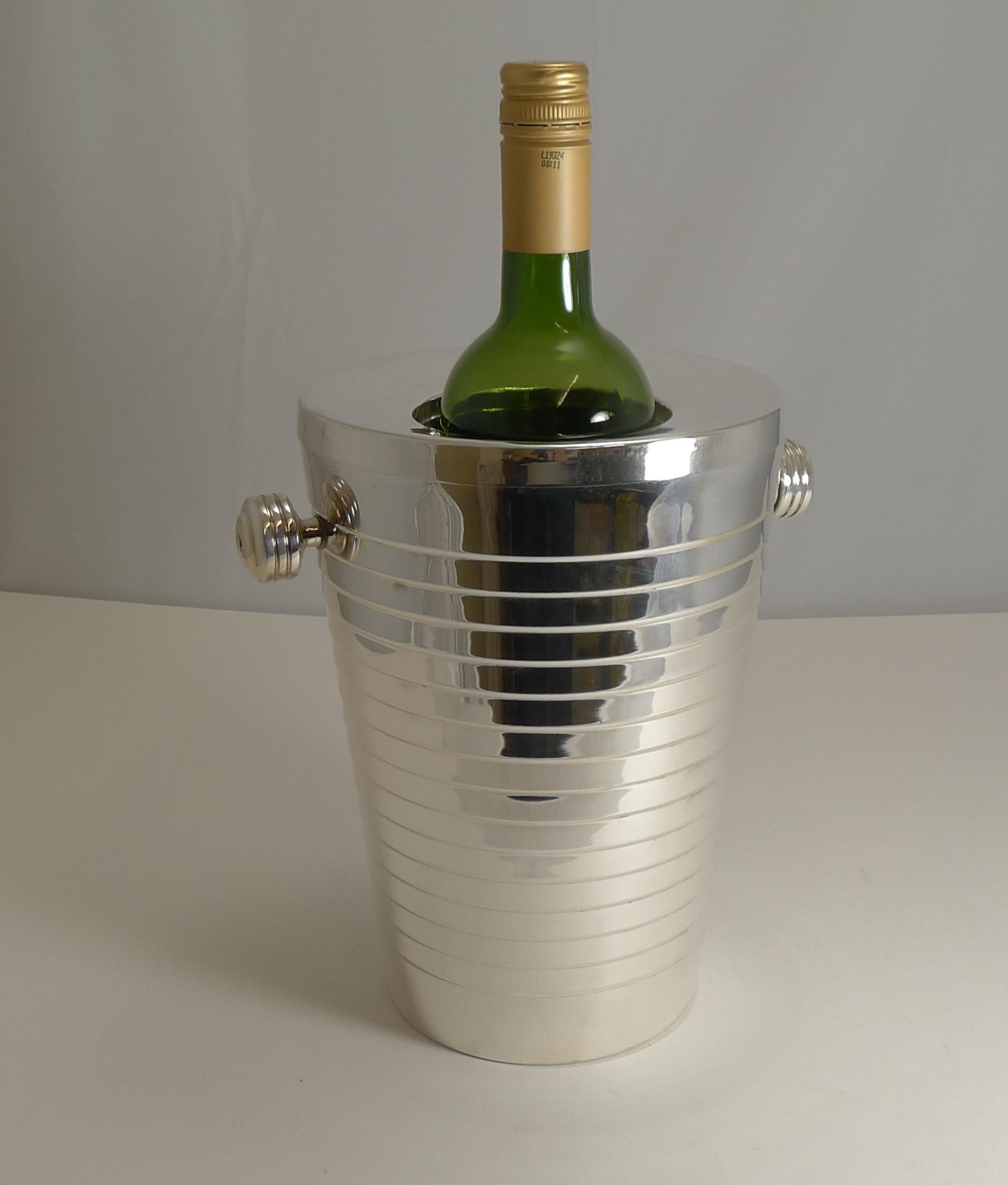 A truly stylish vintage modernist two-piece wine cooler dating to circa 1950.

Made from silver plate and fully marked on the underside for 