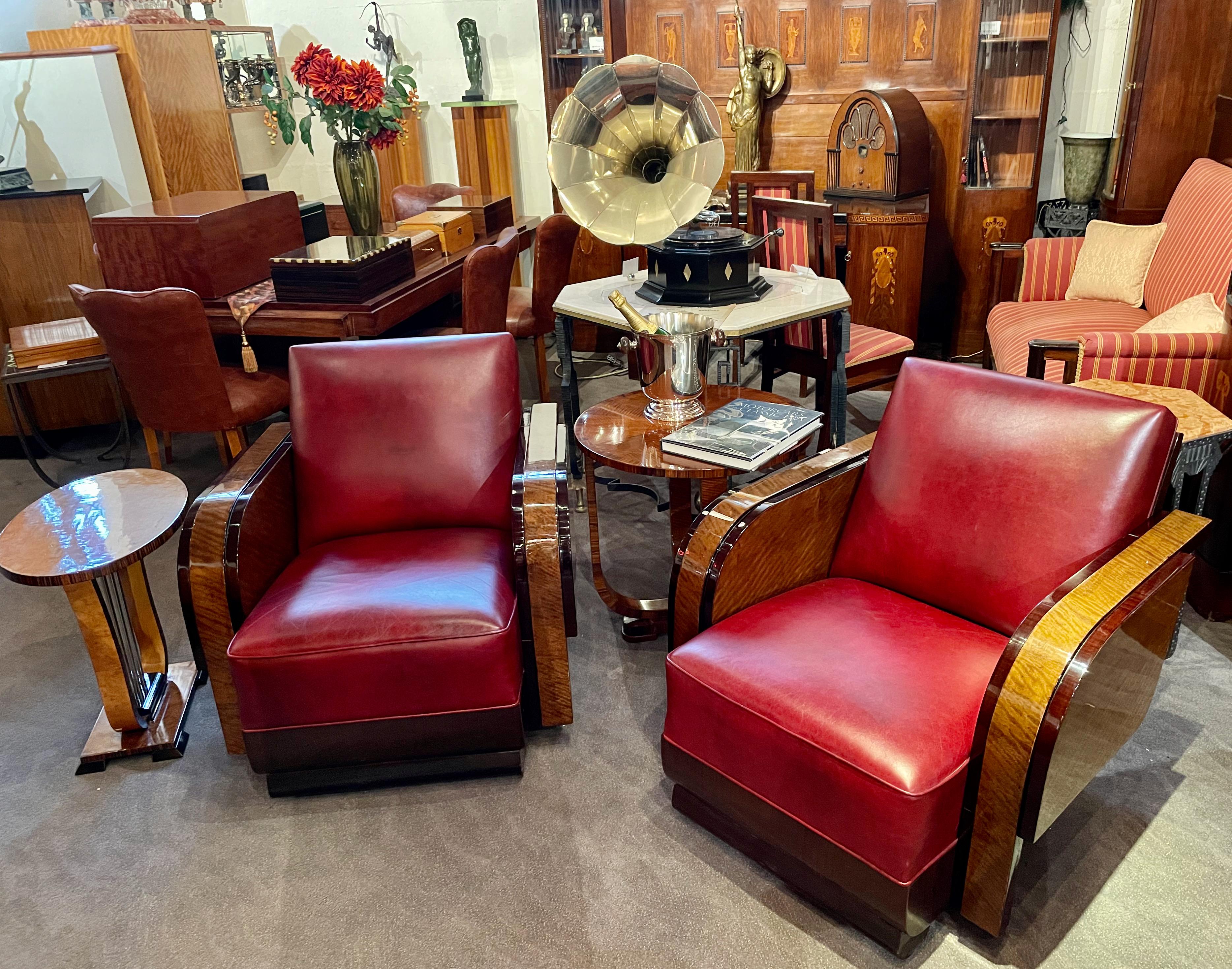 Modernist French wood and leather club chairs. Quality multi-layered wood details rarely seen in French club chairs. The rounded arms with stepped design, both unique inside and outside. Solid wood back, and rounded base showing unusual rounded foot