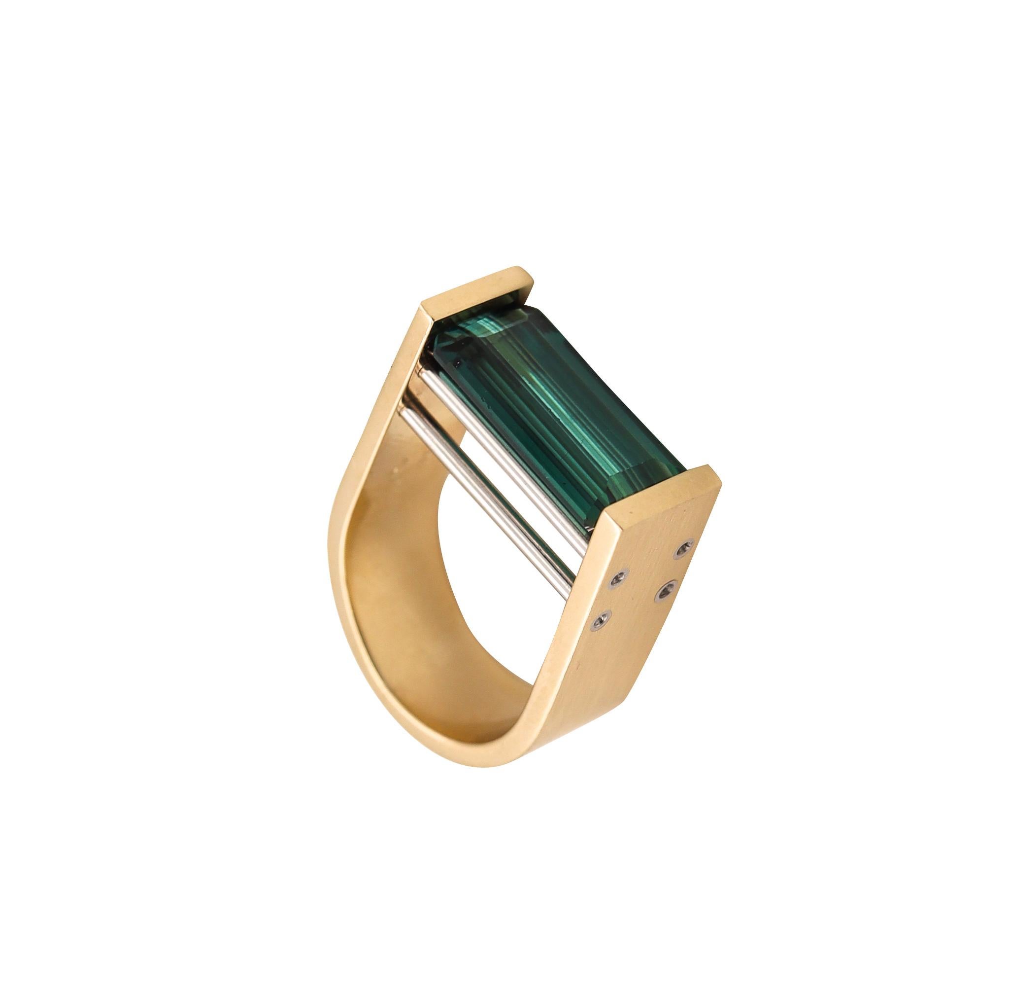 Geometric Sculptural Bauhaus Ring With a Blue Tourmaline.

Beautiful sculptural piece made in northern Europe, most probably Germany or Switzerland. This sleek one-of-a-kind minimalist ring was crafted with Bauhaus patterns in solid yellow gold of