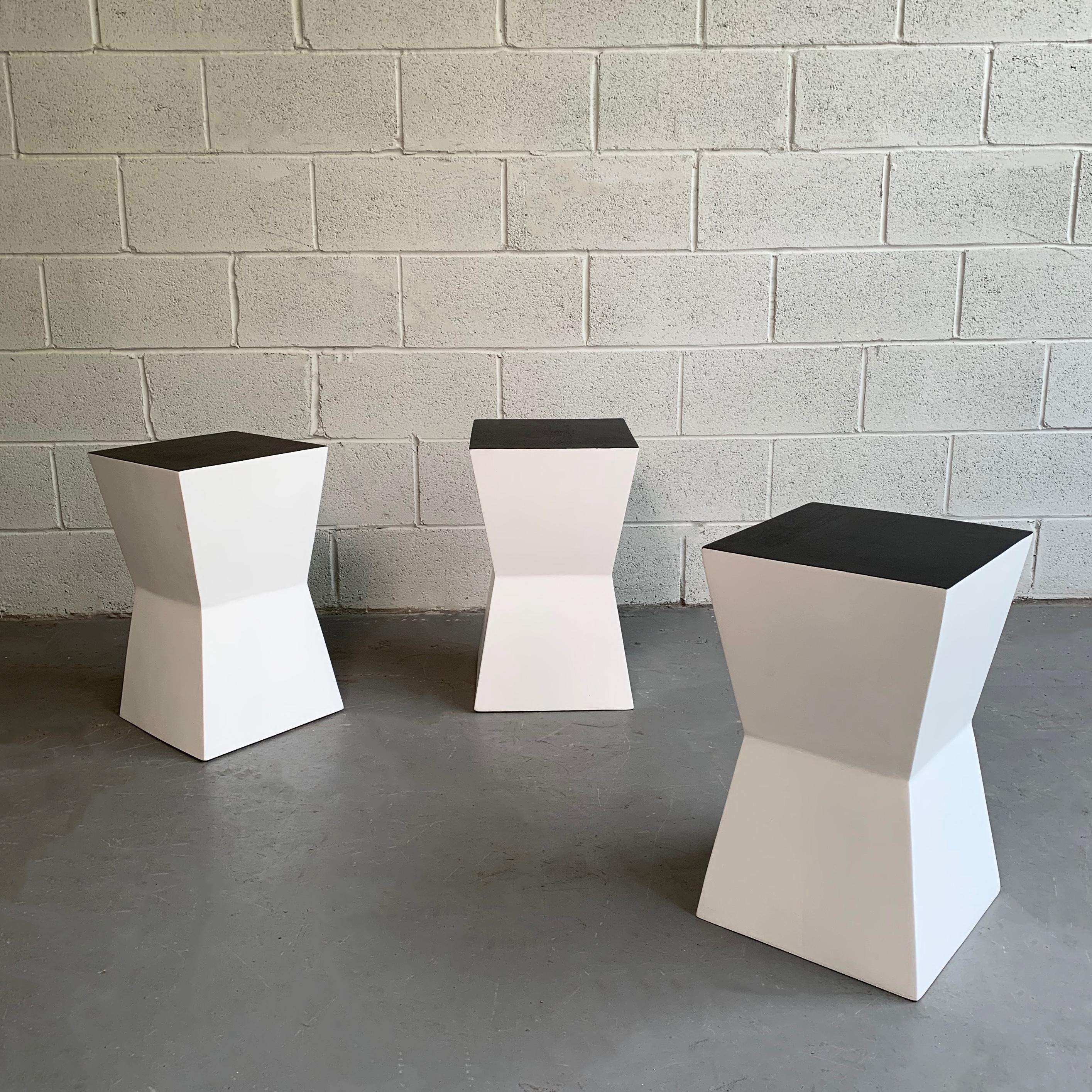 Set of 3, striking, modernist, geometric forms that can be used as stools or stands in graphic, lacquered black and white.