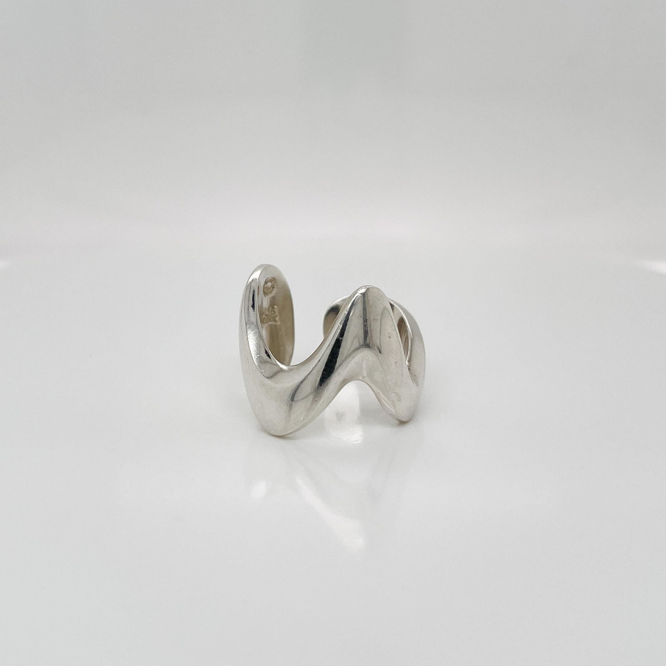 A fine Georg Jensen ring.

In sterling silver. 

Model No. A 77C. 

Designed by Ole Ishøj 

Simply a great Jensen ring!

Date:
20th Century

Overall Condition:
It is in overall good, as-pictured, used estate condition with some fine & light surface