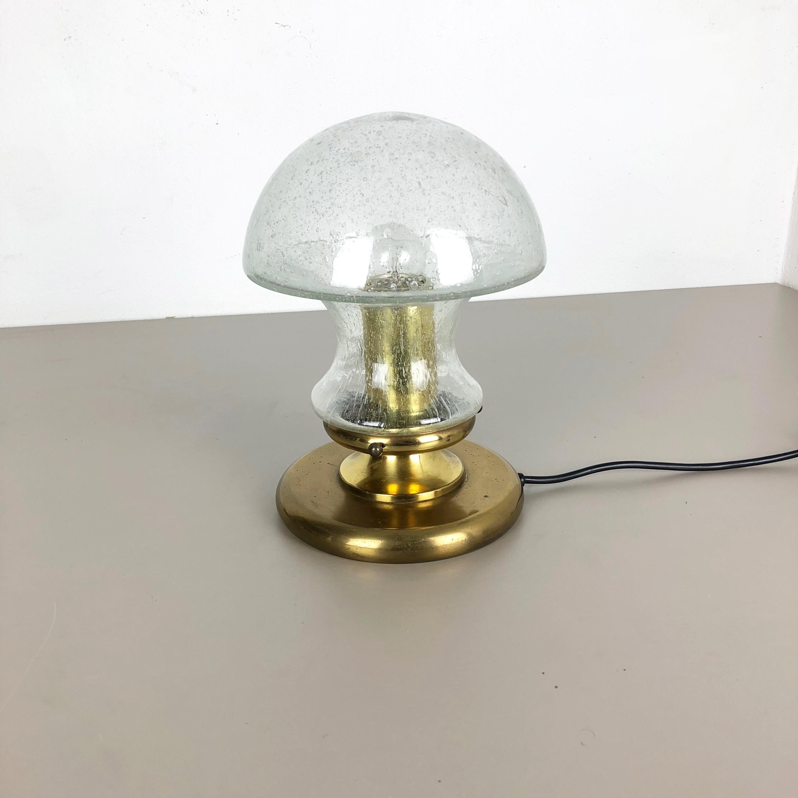 Article:

Table light


Producer:

Doria lights, Germany


Origin:

Germany



Age:

1970s




This 1970s table light was made by Doria lights in Germany. The light base is made of solid metal in brass tone finish, at the top
