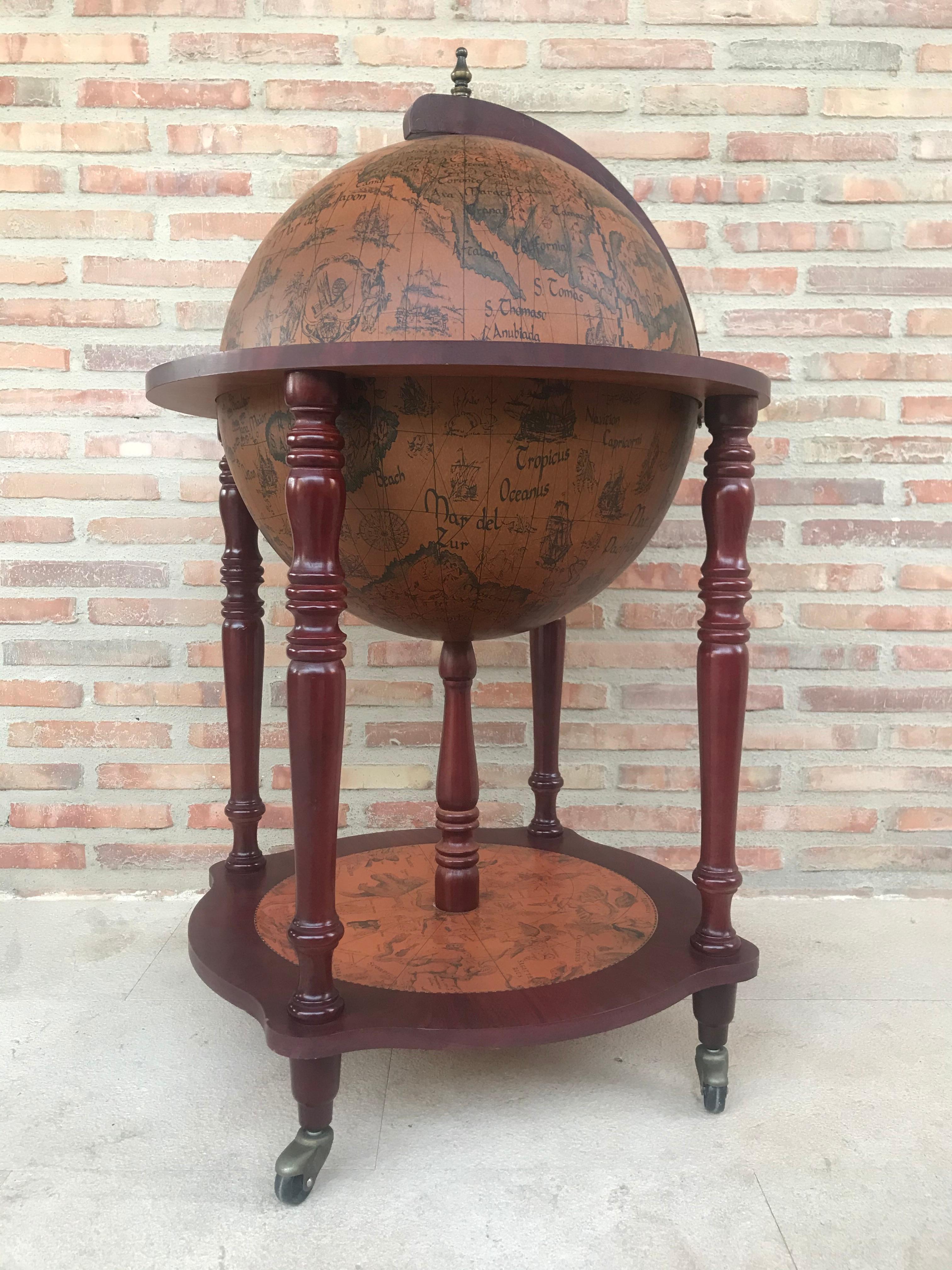 This is a modernist midcentury cocktail drinks cabinet in the form of a globe, circa 1960 in date.

The hinged top section opens to reveal a fitted interior with spaces for glasses and a ice bucket. 

The exterior of the globe has the map of the