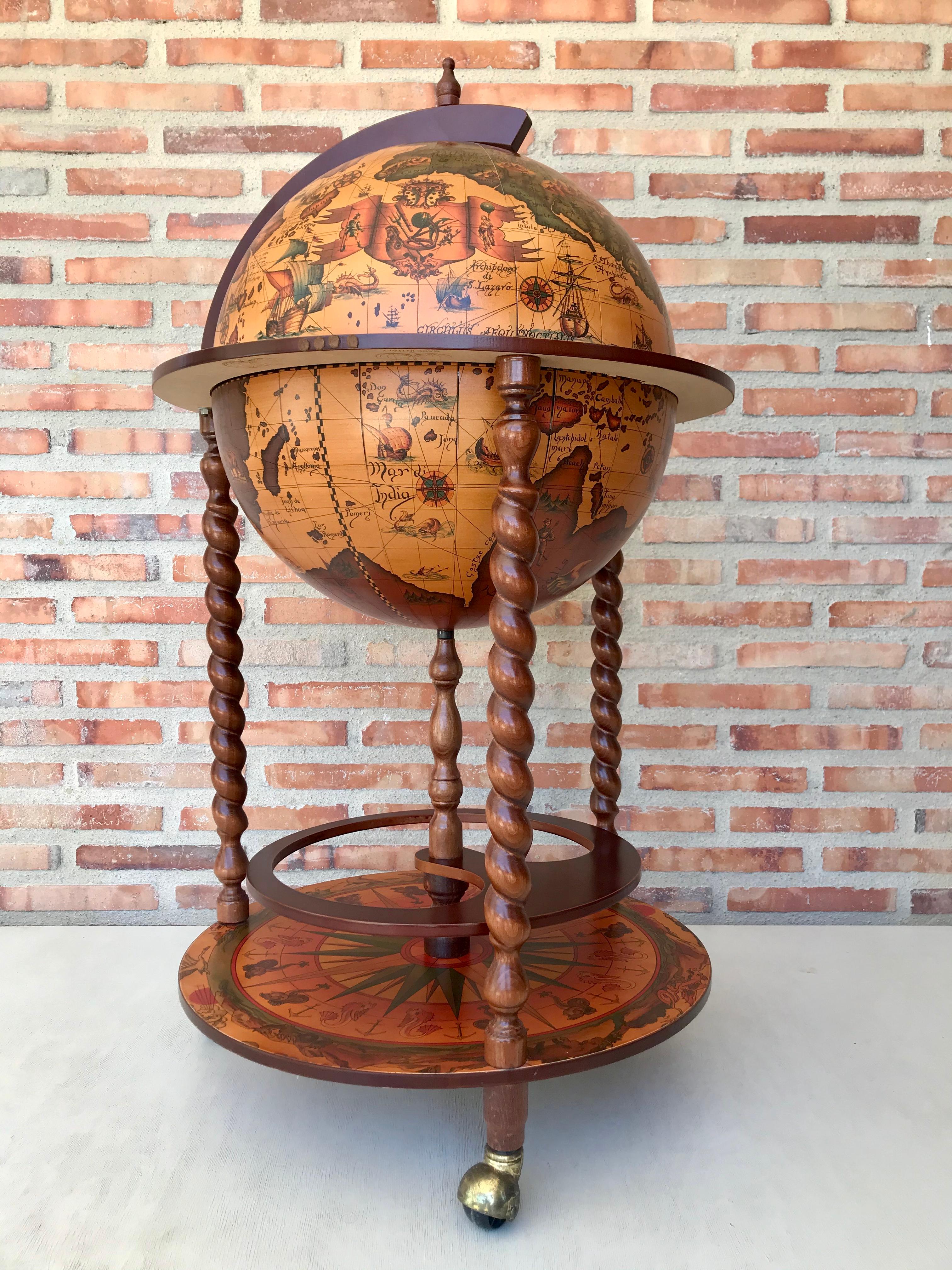 This is a modernist midcentury cocktail drinks cabinet in the form of a globe, circa 1960 in date.

The hinged top section opens to reveal a fitted interior with spaces for glasses and a ice bucket. 

The exterior of the globe has the map of the