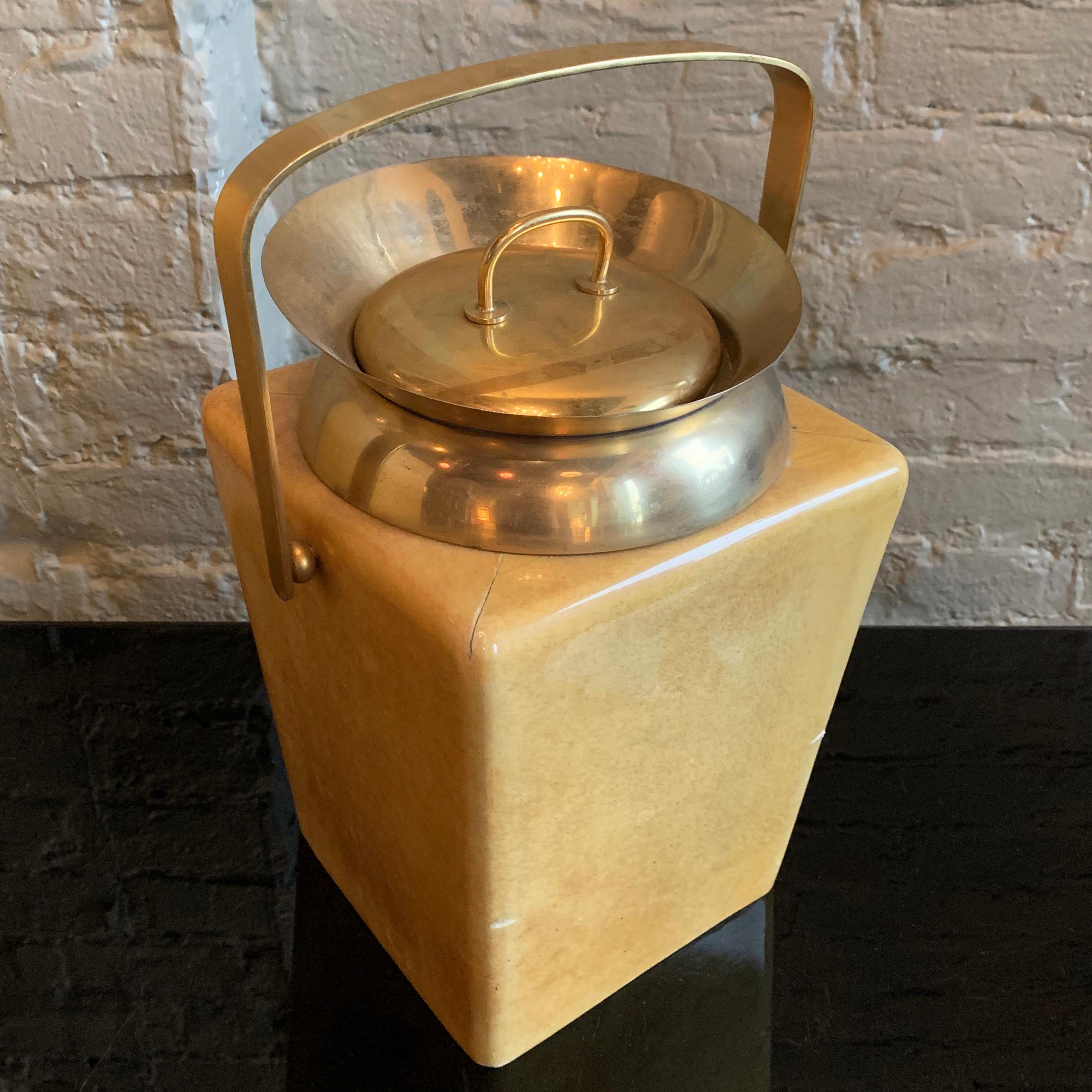 Mid-Century Modern ice bucket by Aldo Tura is covered in lacquered goatskin with brass bucket and handle.