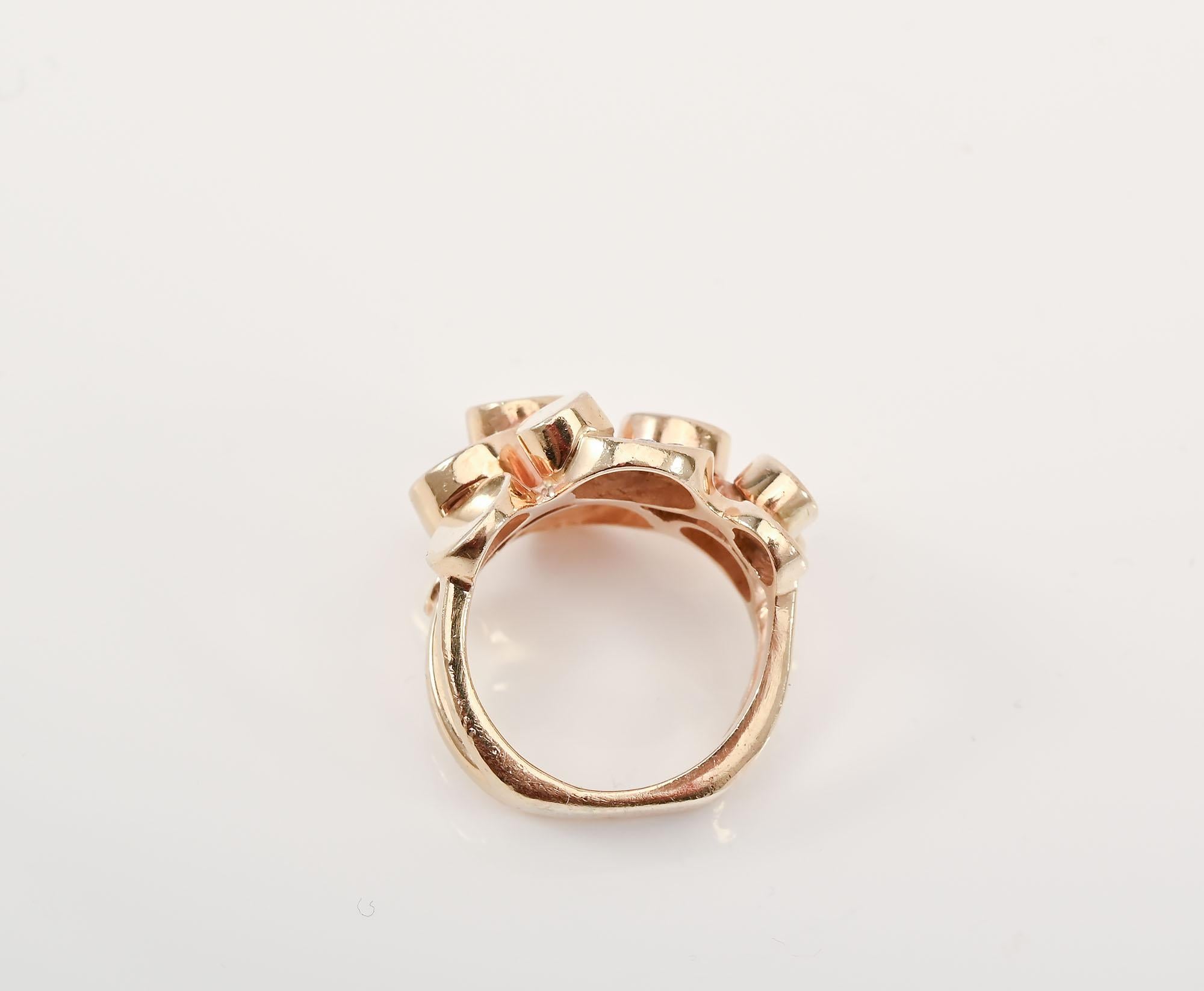 Unusual Modernist 14 karat gold ring made of a series of circles of different sizes and heights. Three of the circles have a total of 6 small diamonds for a hint of bling.The ring is currently size 6 1/2 but can easily be modified up or down. The