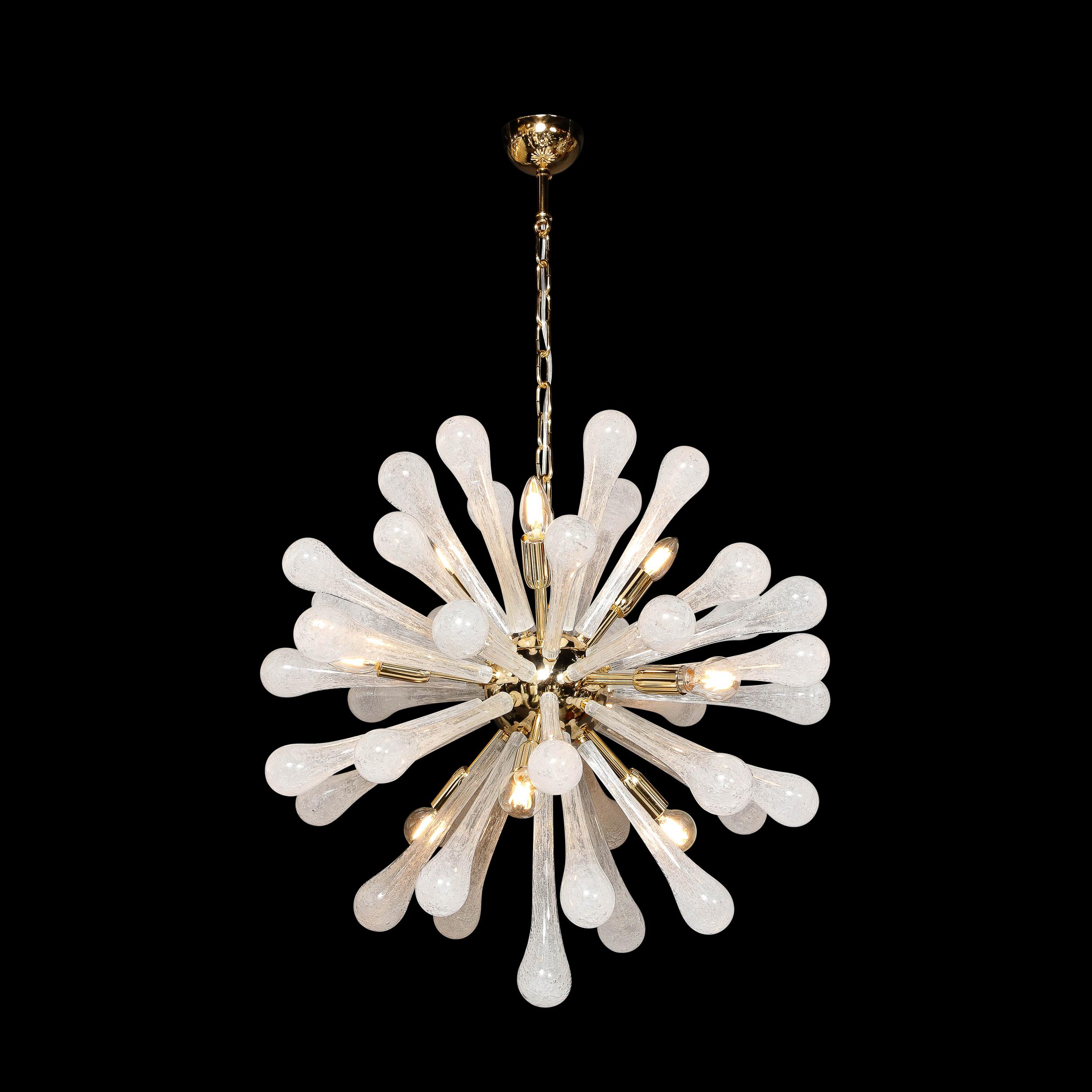This gorgeous and graphic modernist Sputnik chandelier was realized in Murano, Italy- the island off the coast of Venice renowned for centuries for its superlative glass production. It features an abundance of white hand blown Murano textured glass