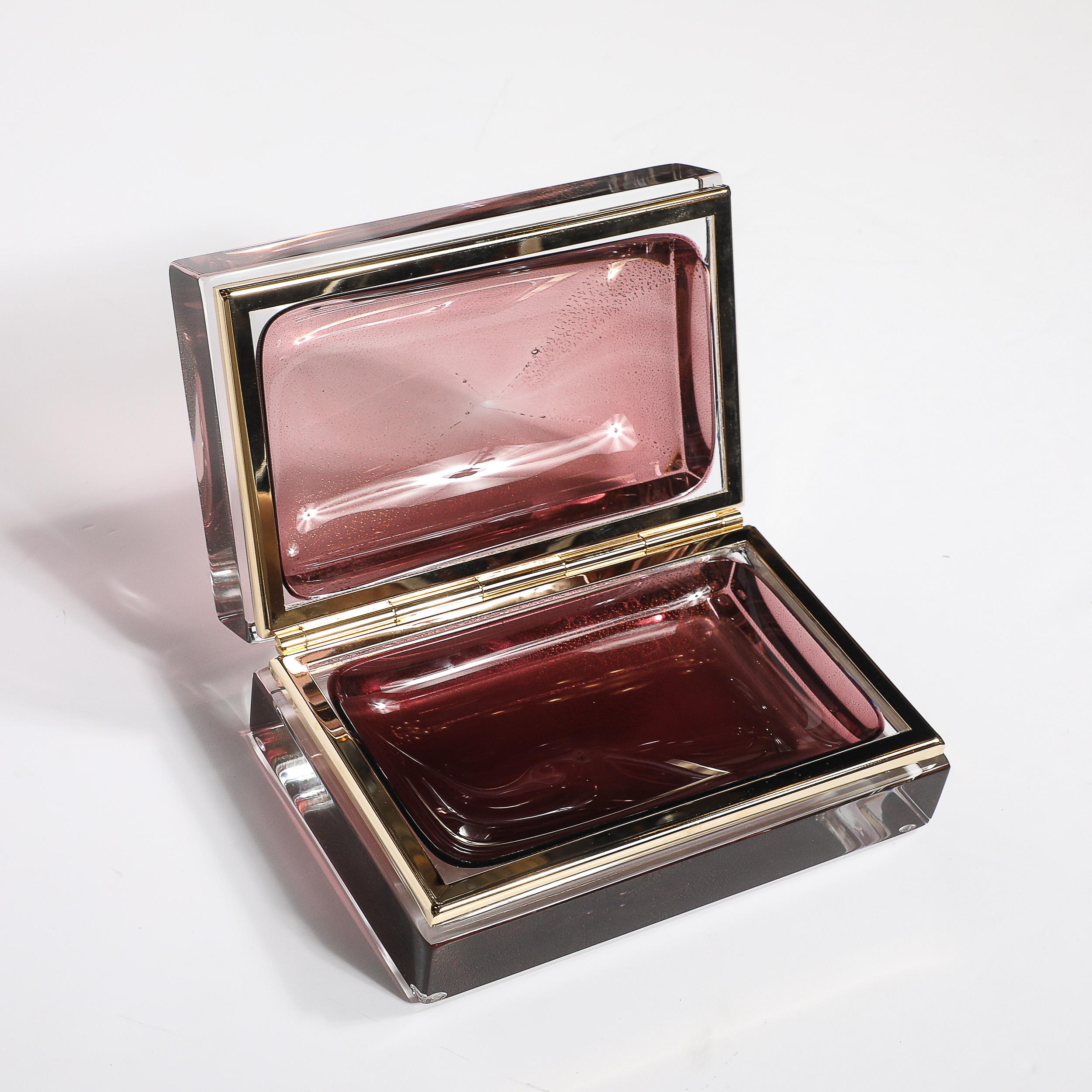 This Modernist Hand-Blown Murano Glass Box in smoked rose is a sophisticated, one-of-a-kind piece that effortlessly blends timeless Venetian craftsmanship with modern design elegance. Handmade in Murano, Italy, during the 21st century, this box