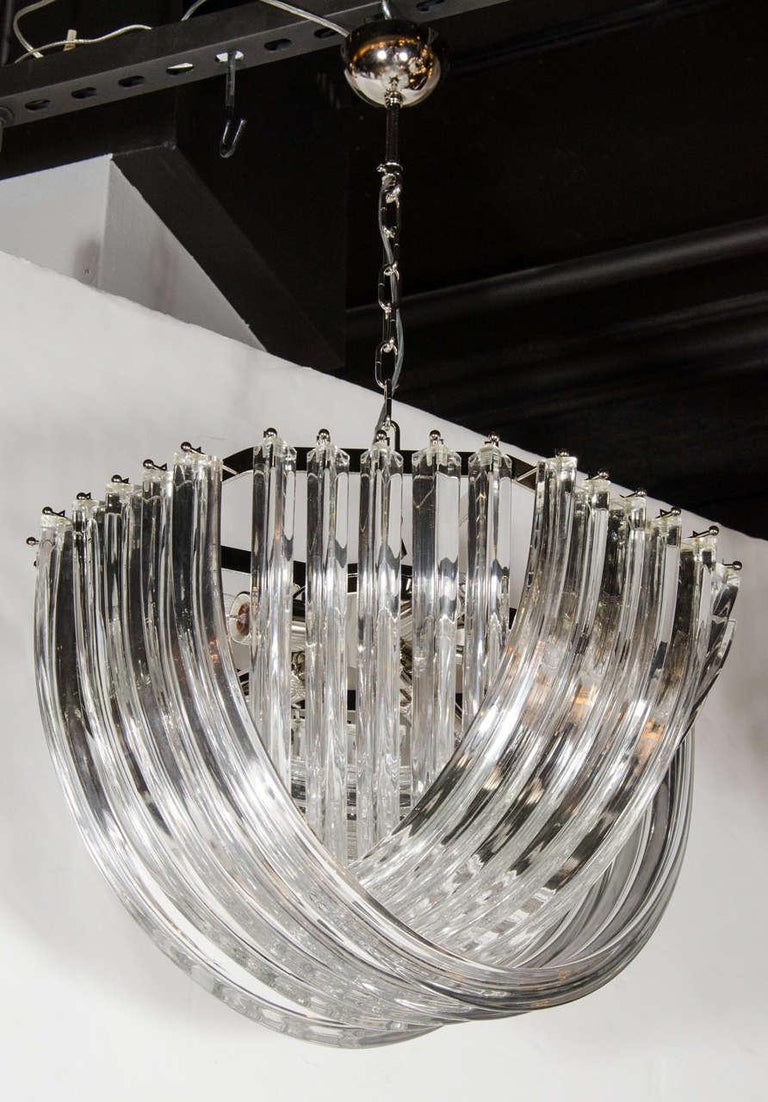 Gorgeous chandelier comprised of numerous curved, handblown Murano glass triedre shaped glass rods that are formed in an overlapping, ribbon-like design, giving this chandelier its elegant overall feel and design. This ribbon chandelier holds five