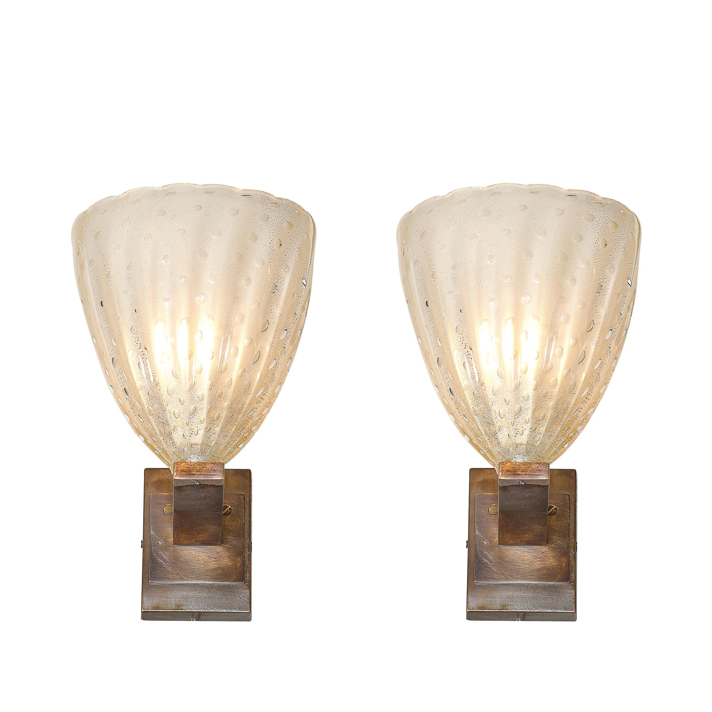 This stunning pair of modernist hand-blown Murano glass sconces, created in Italy in the 21st century, exemplifies the refined craftsmanship and timeless allure associated with Venetian glassmaking. The sconces feature opalene glass, renowned for