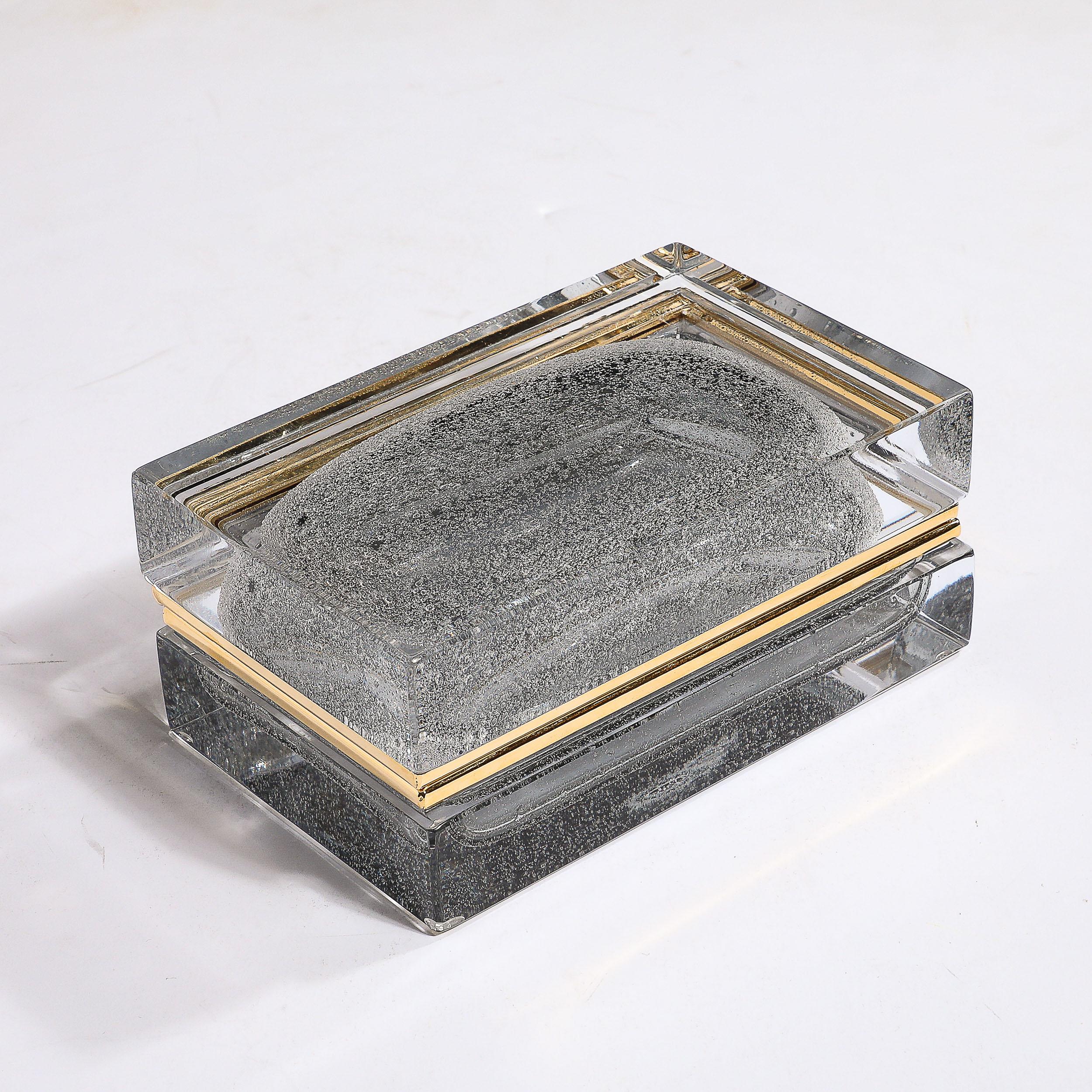 This sleek and beautifully formed Modernist Hand-Blown Murano Glass Box W/Grey Bullicante Detailing and Brass Fittings originates from Italy during the 21st Century. This box is rectangular in form in remarkably high quality transparent glass with