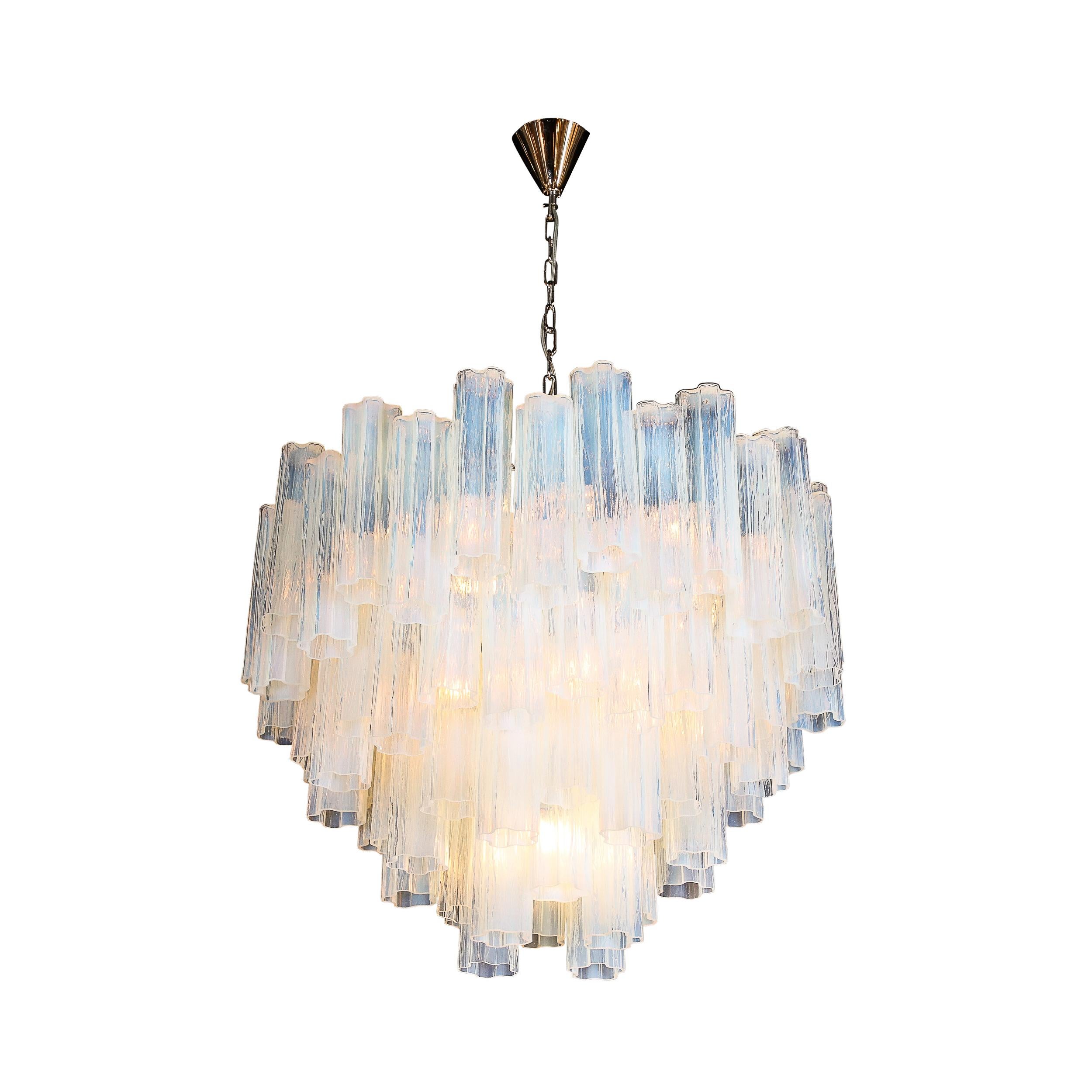 This glamourous and inviting Modernist Four-Tier Opalescent Tronchi Chandelier originates from Murano Italy 21st Century. Featuring four tiers of stunning Tronchi glass featuring Faux Bois texturing in a gleaming semi-translucent opalescent hue,