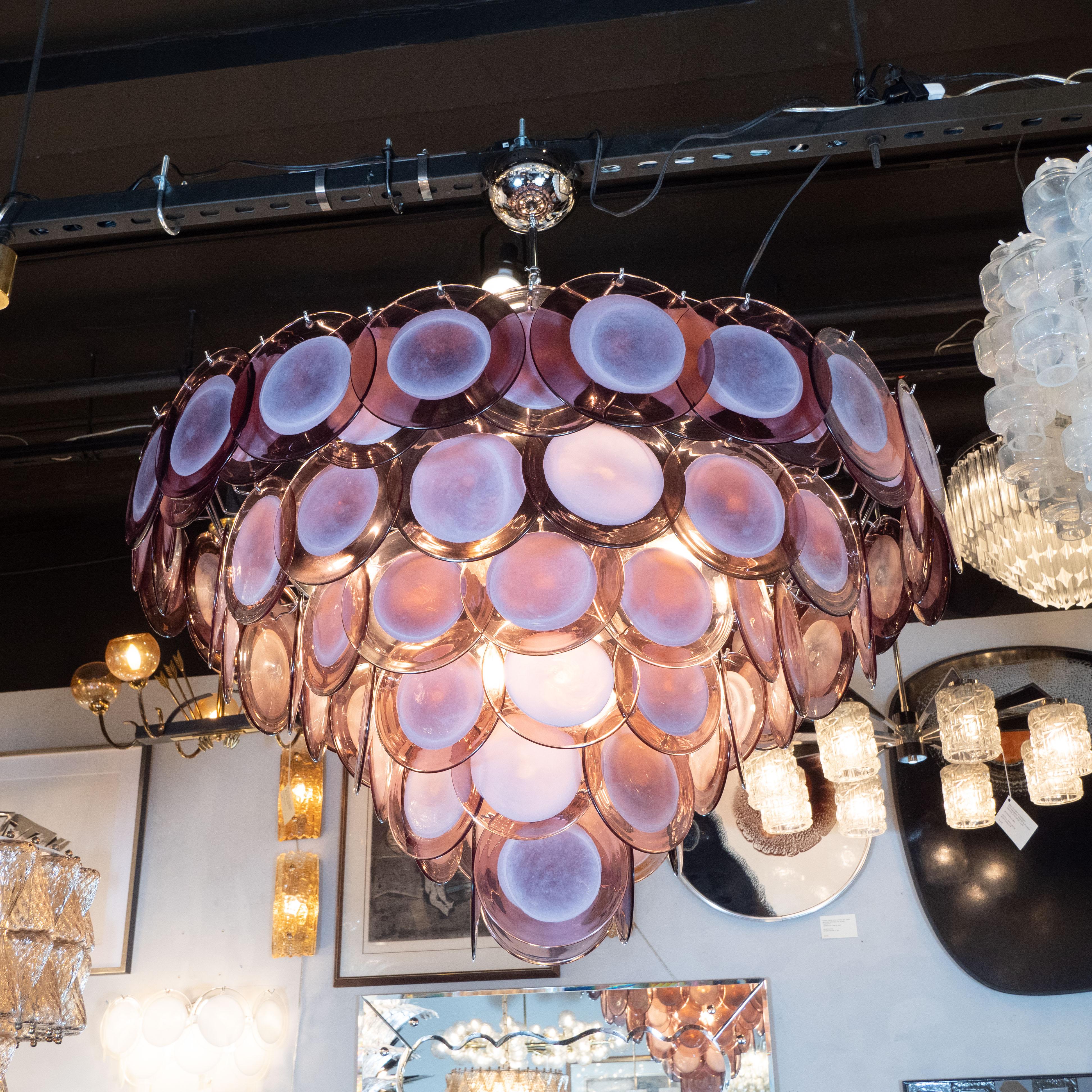 This stunning modernist chandelier was realized in Murano, Italy, the island off the coast of Venice renowned for centuries for its superlative glass production. It features six graduated tiers consisting of hand blown Murano glass with opaque