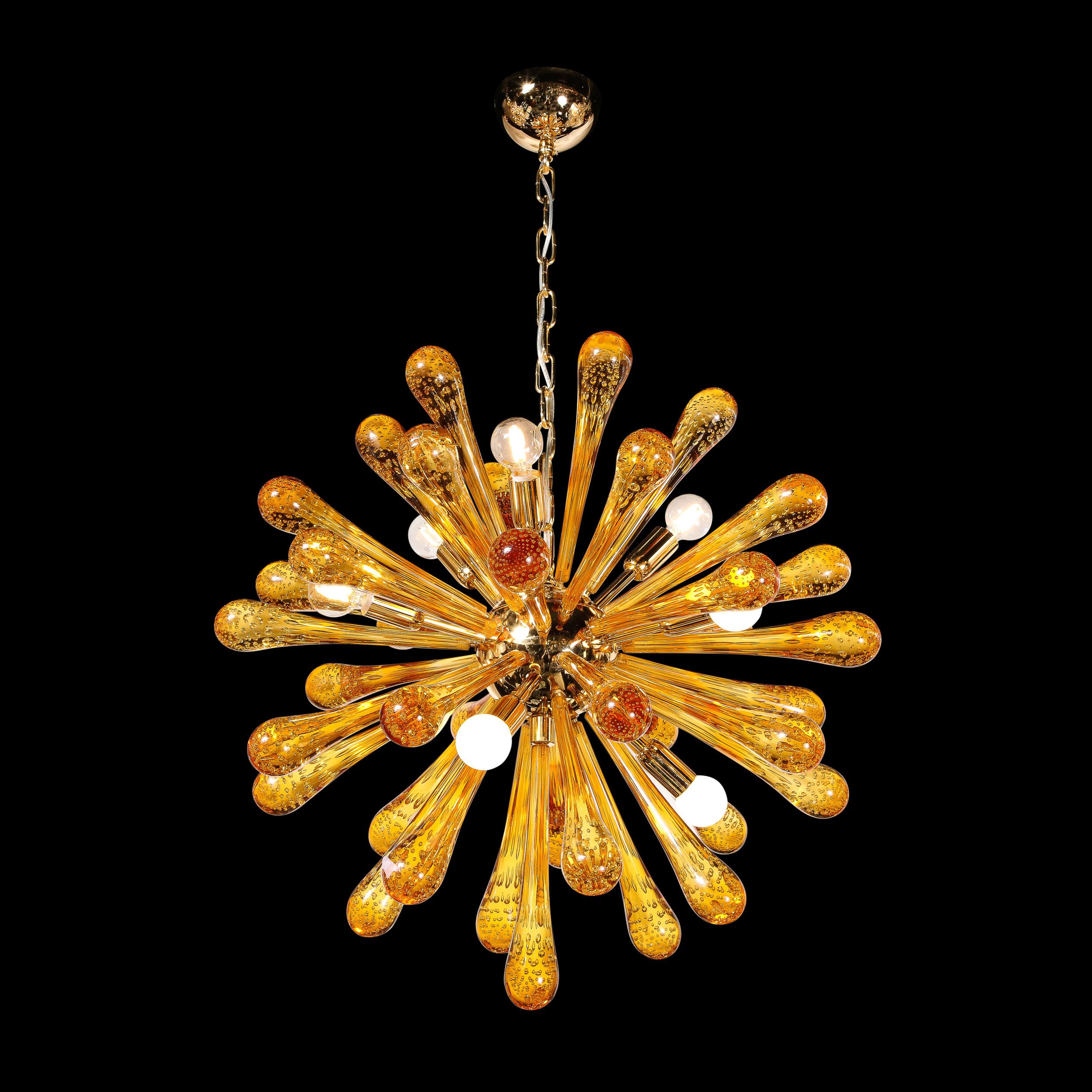 This graphic and sophisticated Sputnik was hand blown in Murano, Italy- the island off the coast of Venice renowned for centuries for its superlative glass production. It features an abundance of glass rods with bulbous ends of translucent glass in