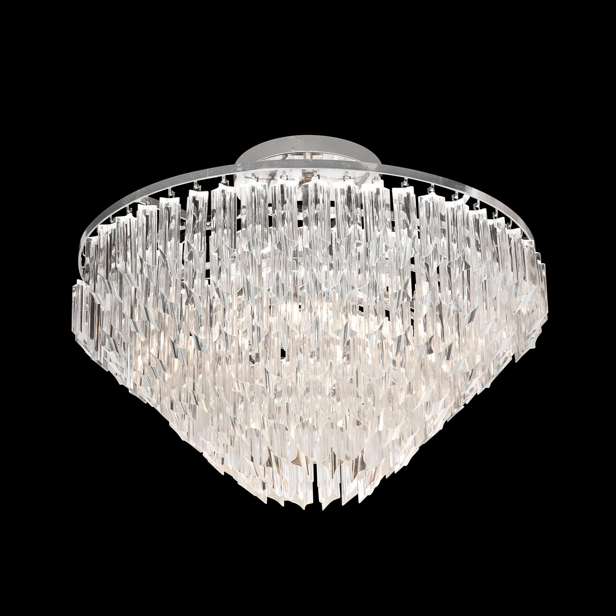 This elegant modernist semi flush chandelier was handblown in Murano, Italy- the island off the coast of Venice renowned for centuries for its superlative glass production. It features a conical form composed of six tiers of translucent camer