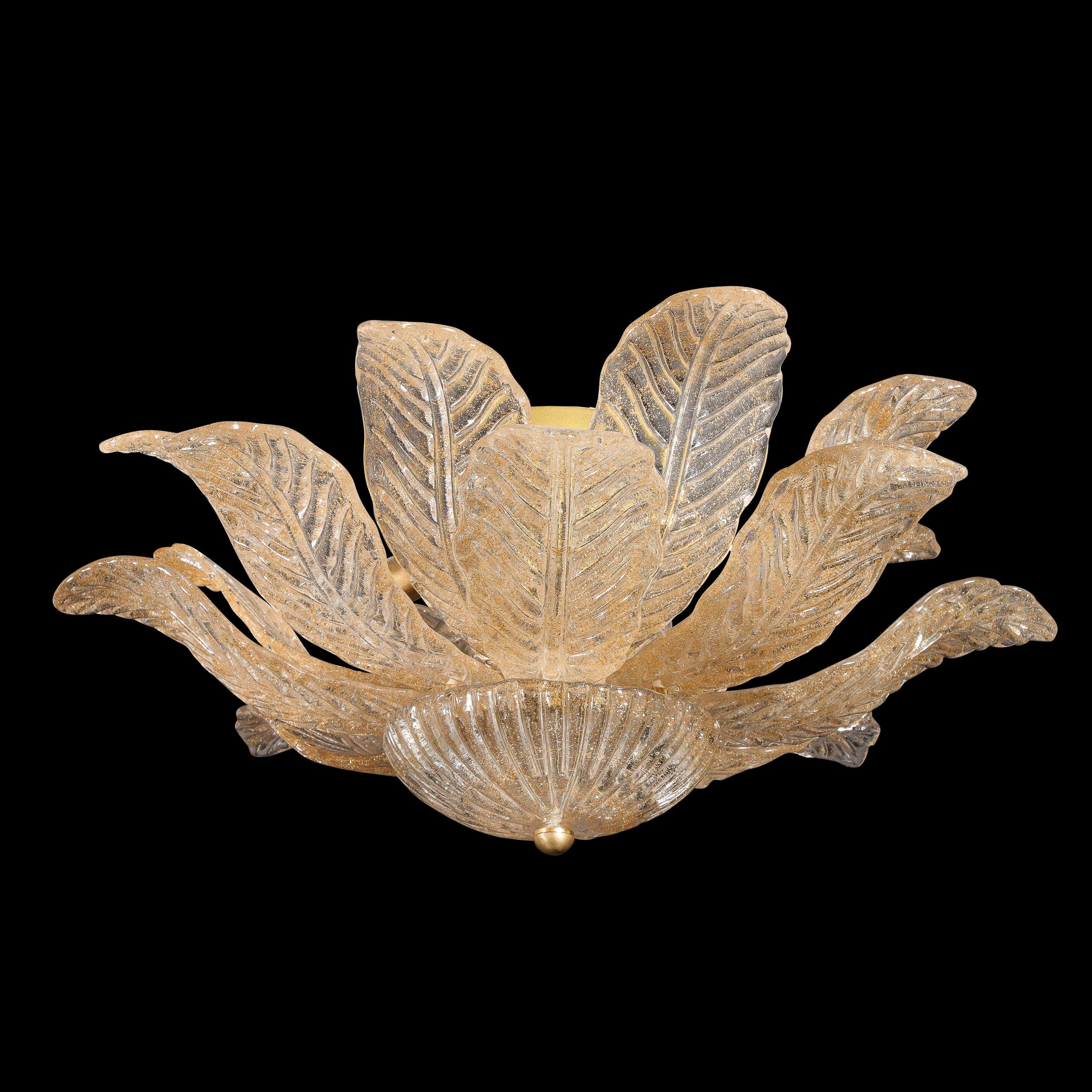 This elegant modernist leaf form flush mount chandelier was realized in Murano, Italy- the island off the coast of Venice renowned for centuries for its superlative glass production- during the 21st century. It features a profusion of stylized