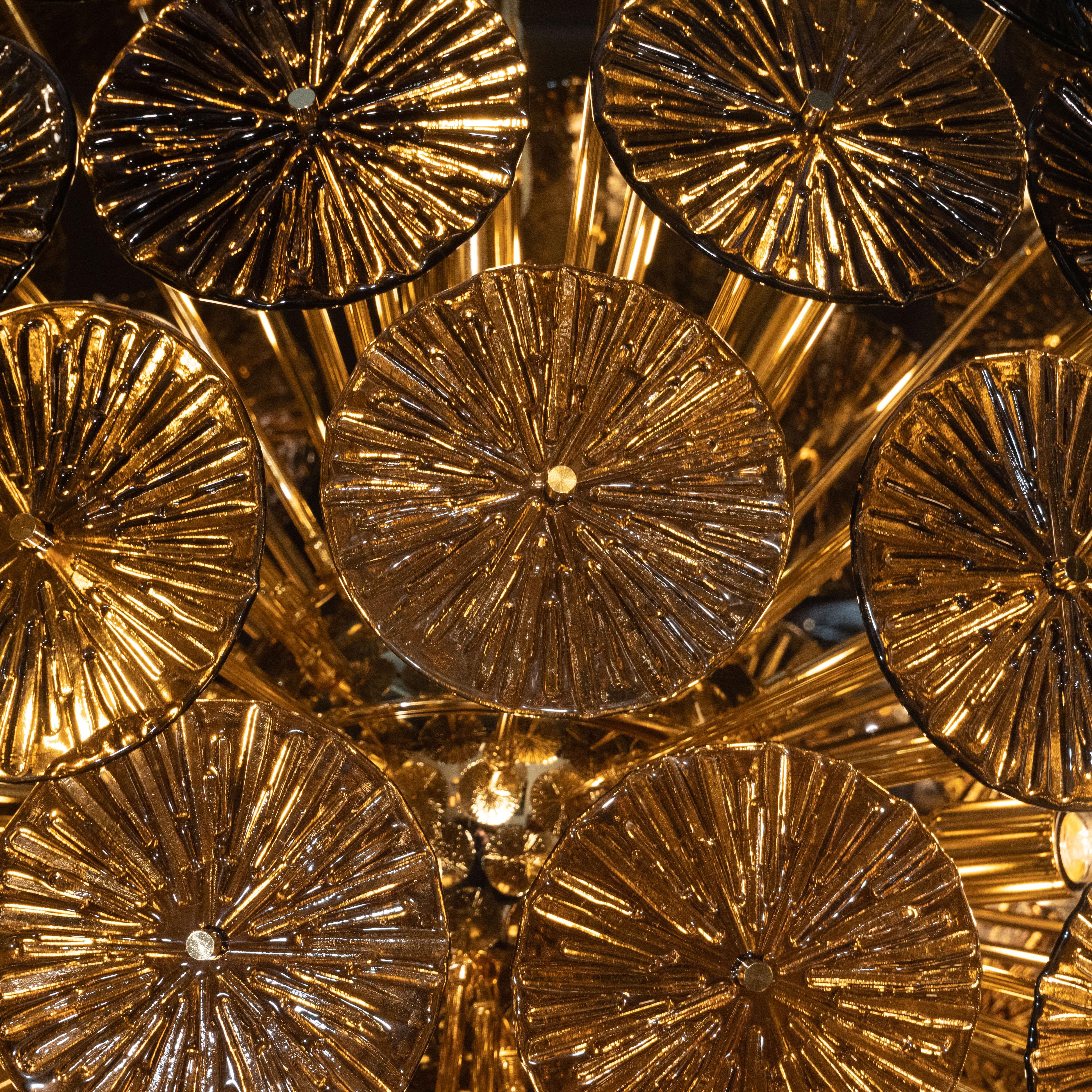 This graphic and dramatic sputnik chandelier was handblown by our atelier in Murano, Italy- the island off the coast of Venice renowned for centuries for its superlative glass production- exclusively for us. It features an abundance of circular