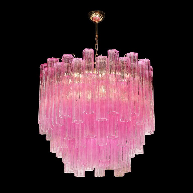 This stunning and vibrant modernist tronchi chandelier was handblown in Murano, Italy- the island off the coast of Venice renowned for centuries for its superlative glass production. It features an abundance of tronchi crystals in a rich translucent
