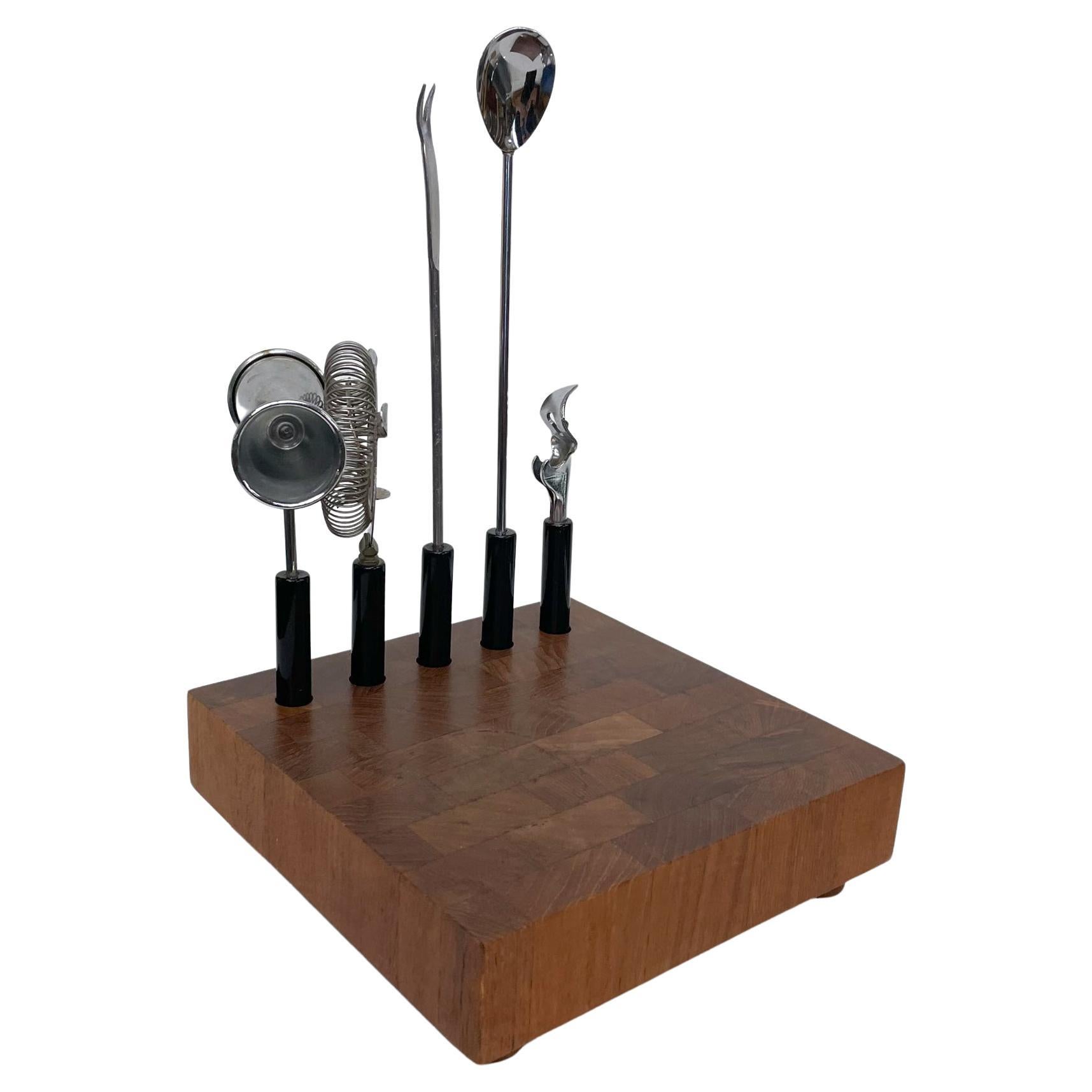 Modern cocktail bar tool set ATAPCO Hong Kong
Teak wood base 8 x 8 x 2.25 H with tools, 12.5 inches
Handcrafted staved teak board, maker signed at the bottom. 
Black plastic handles with chrome plated steel.
Includes 5 cocktail barware tools on