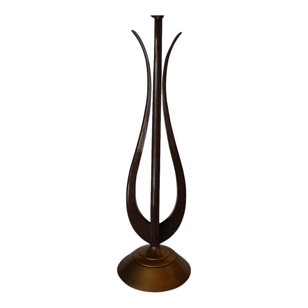 Pair of attractive Mid-century tulip-shaped sculptural Walnut wood table lamps with Brass tone base resembling the shape of a Greek harp. Each lamp features a danish Inspired design with a unique flair reminiscent of American companies like Knoll