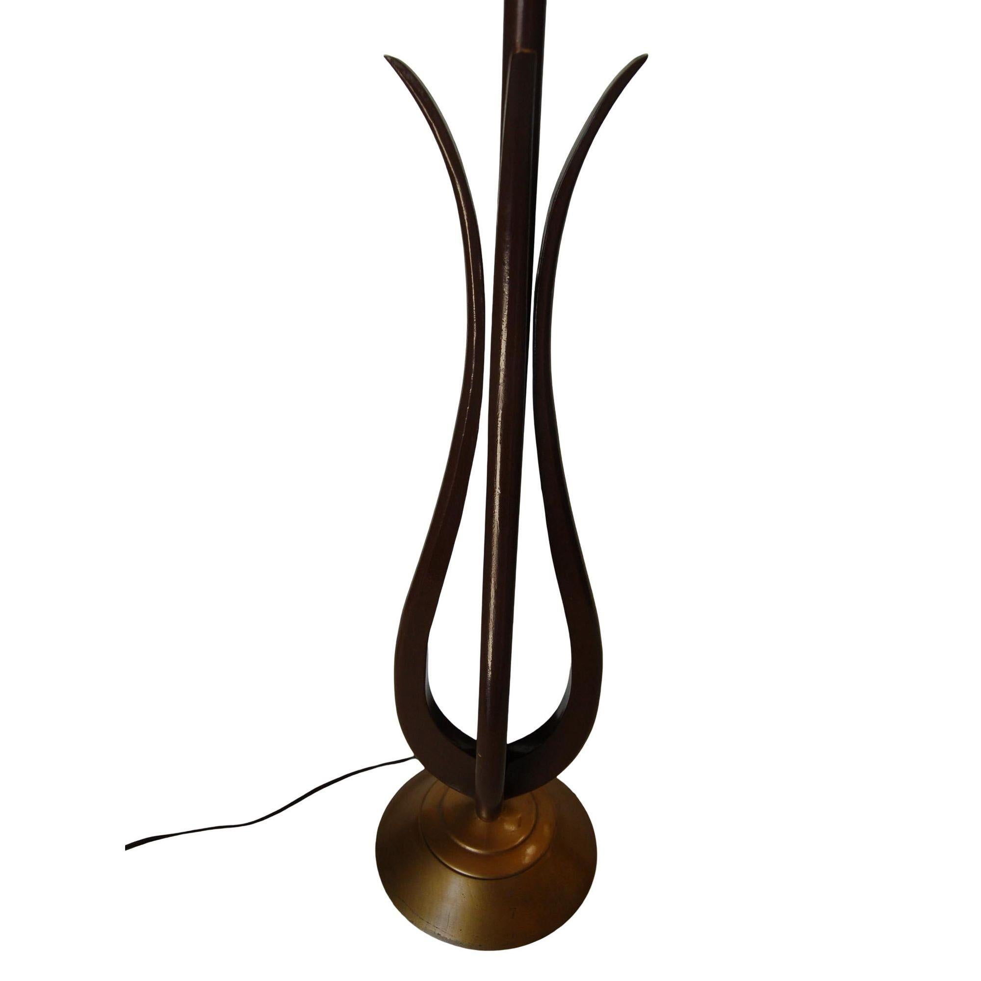 Pair of attractive Mid-century tulip-shaped sculptural Walnut wood table lamps with Brass tone base resembling the shape of a Greek harp. Each lamp features a danish Inspired design with a unique flair reminiscent of American companies like Knoll