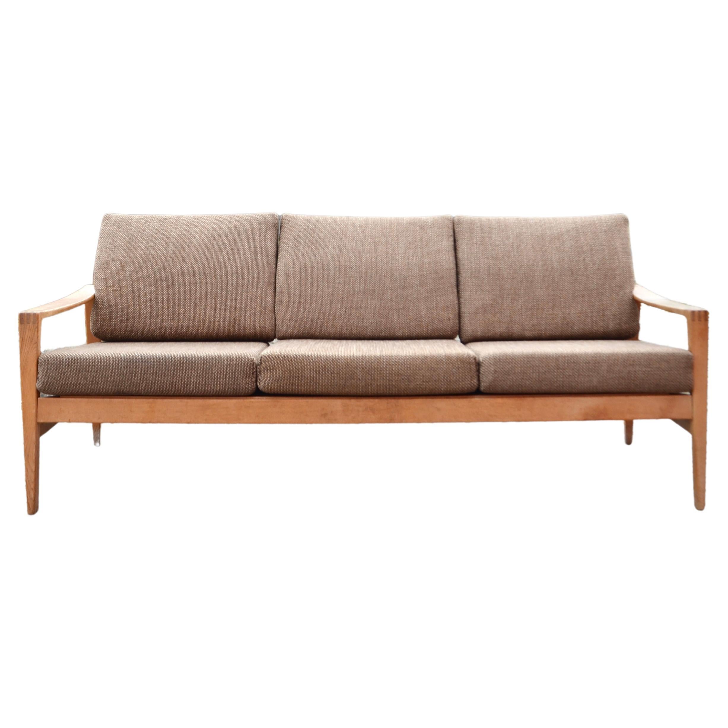 Rare Sofa designed by Hartmut Lohmeyer for Wilkhahn.
Minimalistic design.
Oak wood and brown wool.
Beautiful Patina on the wood.
A very comfortable seating comfort.
    
