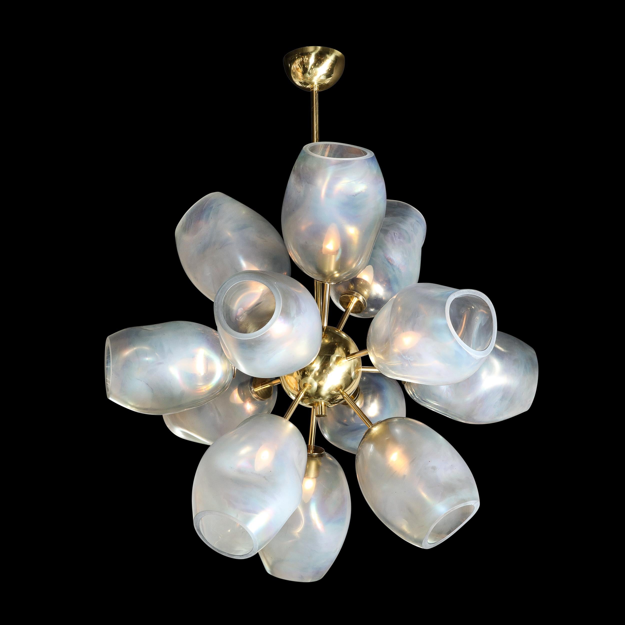 Exclusive to High Style Deco, this stunning modernist chandelier was handblown in Murano, Italy- the island off the coast of Venice renowned for centuries for its superlative glass production. This beautiful fixture offers twelve lustrous polished