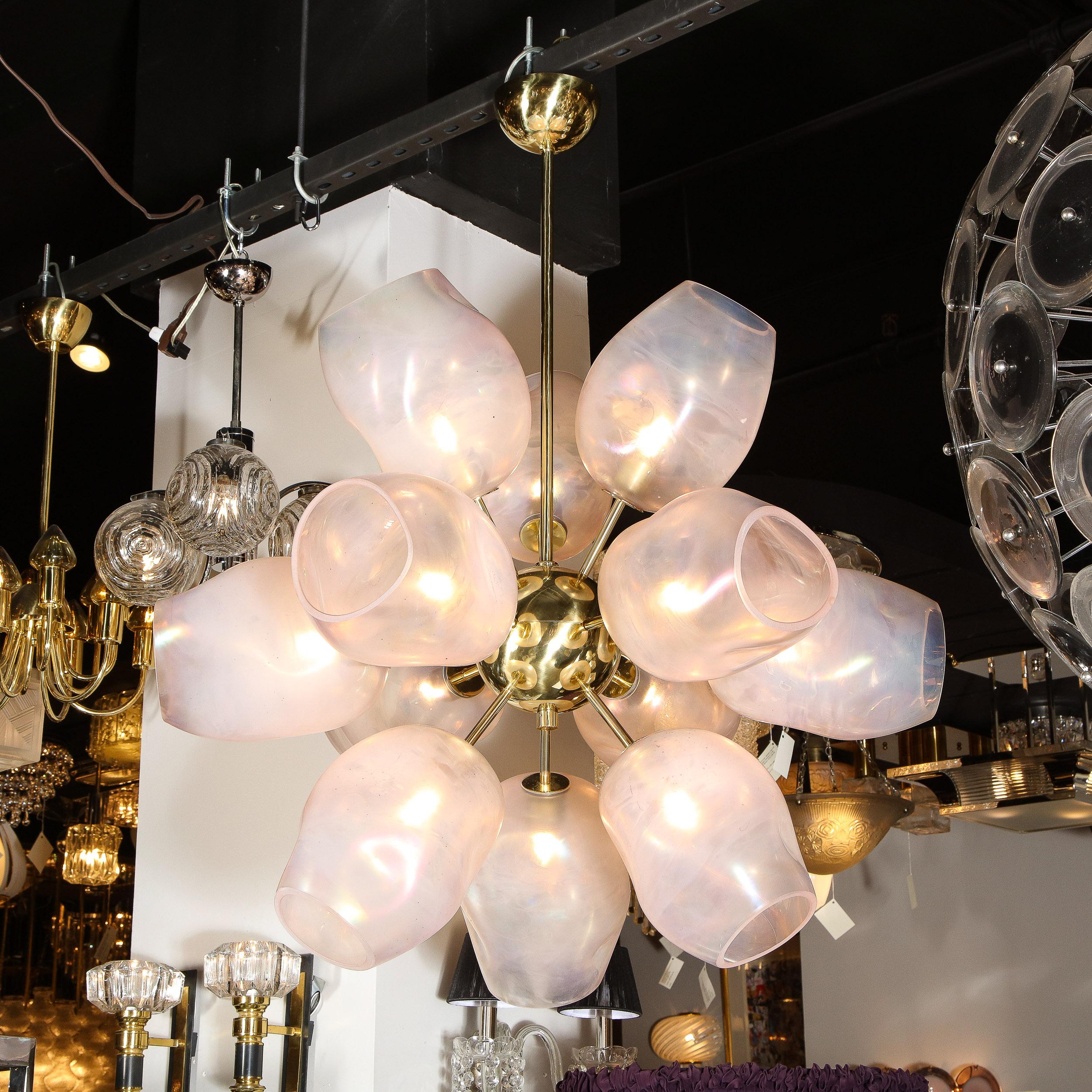 Exclusive to High Style Deco, this stunning modernist chandelier was handblown in Murano, Italy- the island off the coast of Venice renowned for centuries for its superlative glass production. This beautiful fixture offers twelve lustrous polished