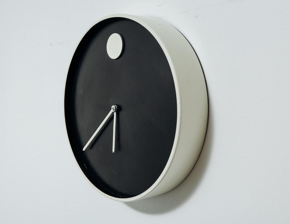 Modernist clock designed by Nathan George Horwitt for Howard Miller. Black and white. Missing glass.