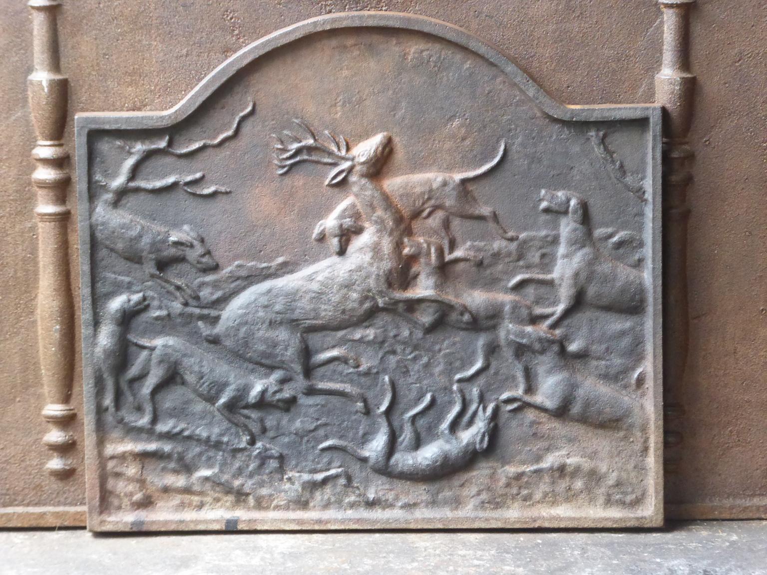 20th century French fireback with a hunting scene. The fireback is made of cast iron. The patina is natural brown. Upon request it can be made black.