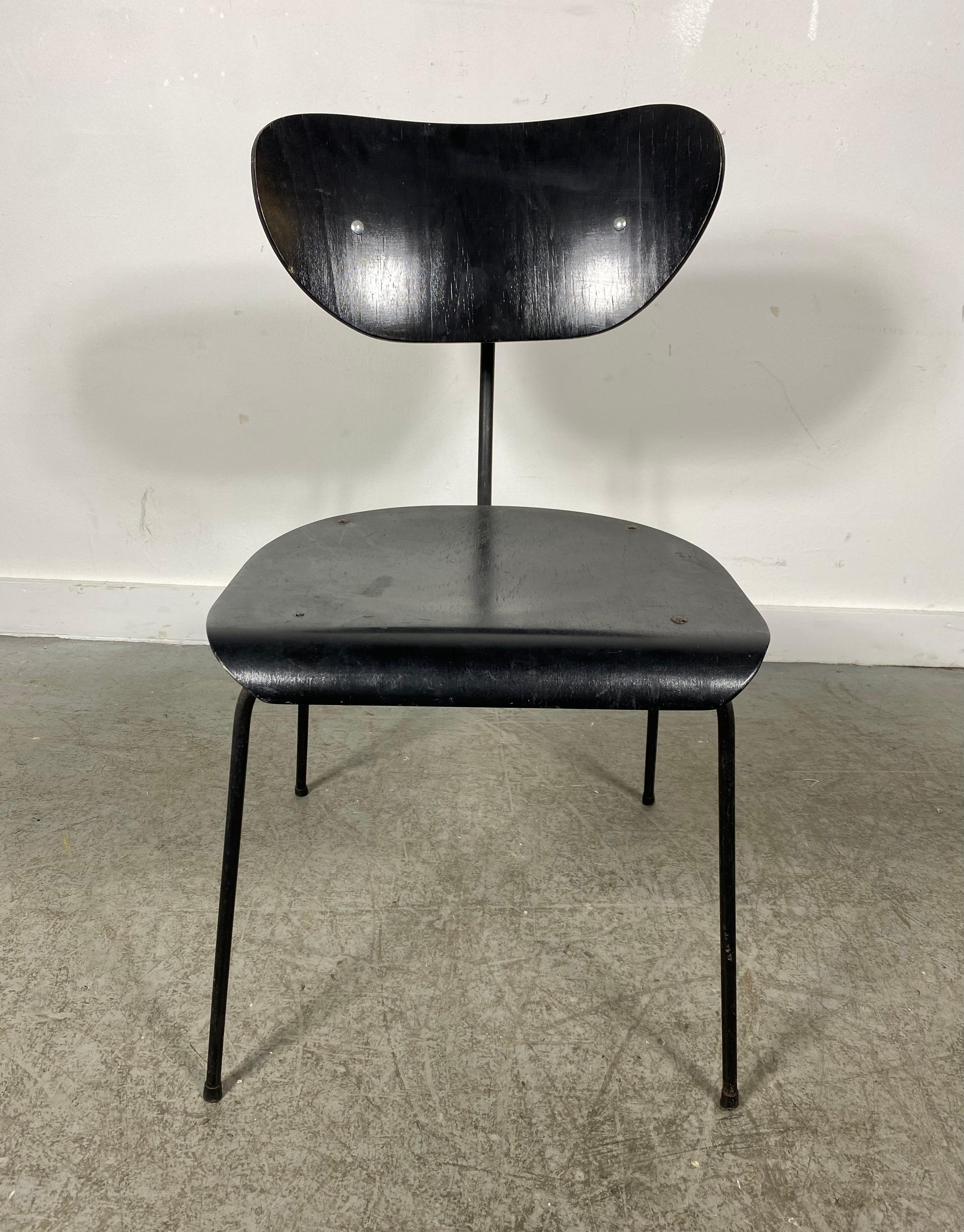 Modernist Iron and Plywood side chair attributed to Egon Eiermann, Germany.. Dramatic lines,,exaggerated curved iron back support as well as unusual back seat rest,,Extremely comfortable..Perfect modern accent chair,
Egon Eiermann was one of