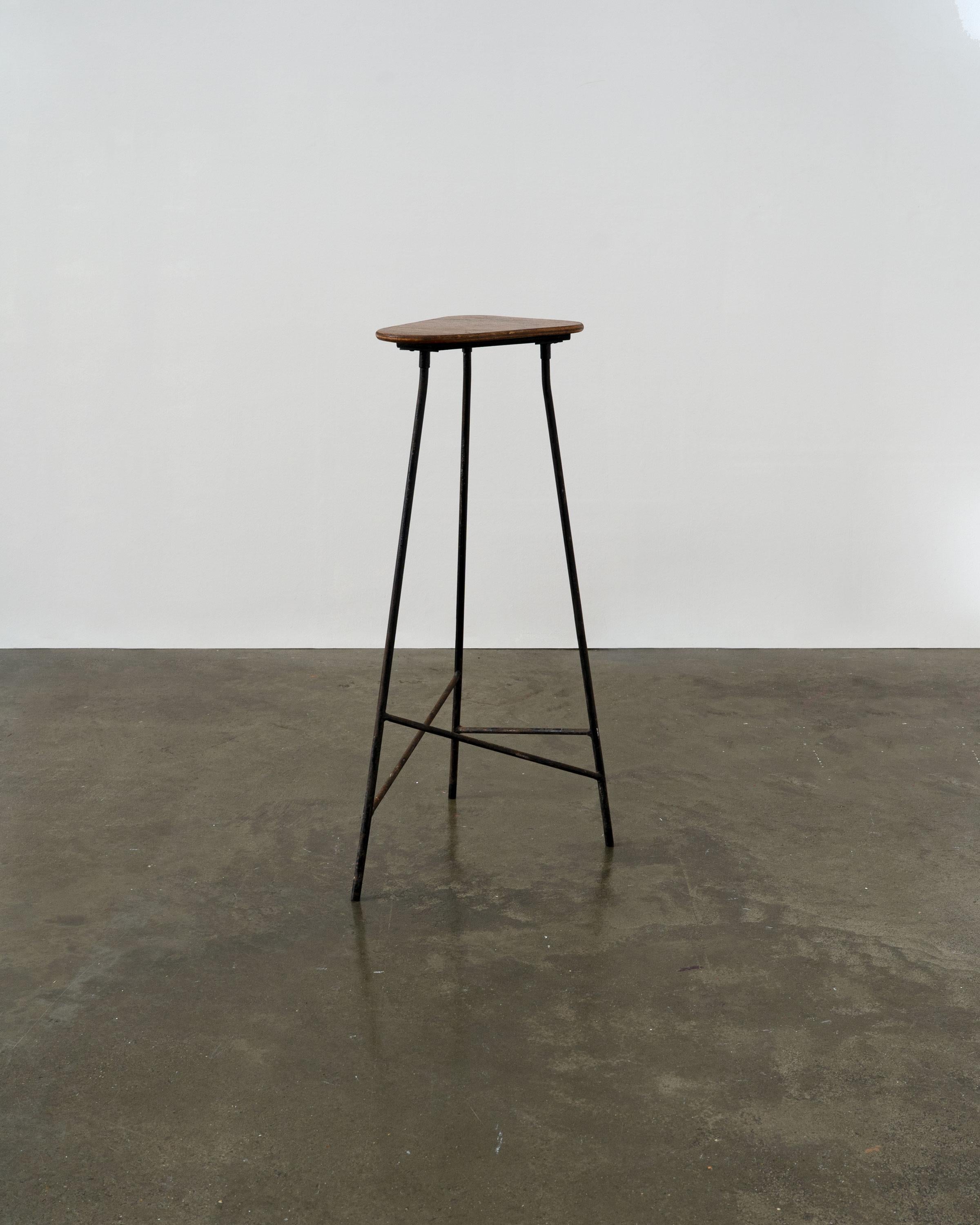 A vintage pedestal table / bar stool, handmade from wrought iron and plywood.

Dimensions (cm, approx)
Height: 81
Width: 32
Depth: 26
