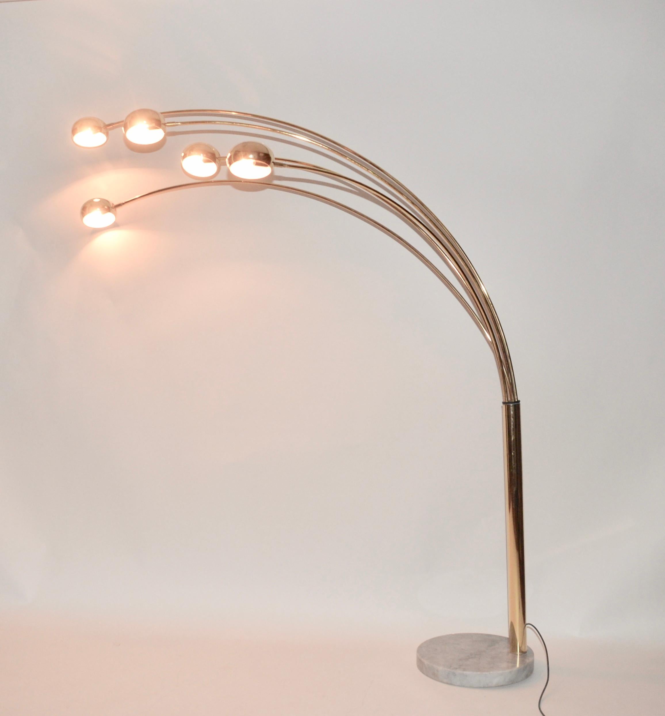 This is a very impressive large Italian modernist five arm floor lamp on a solid marble base. This light has five retro brass shaded suspended by the brass arc's that have a swivel action to create a cascading effect with your lighting or to spread