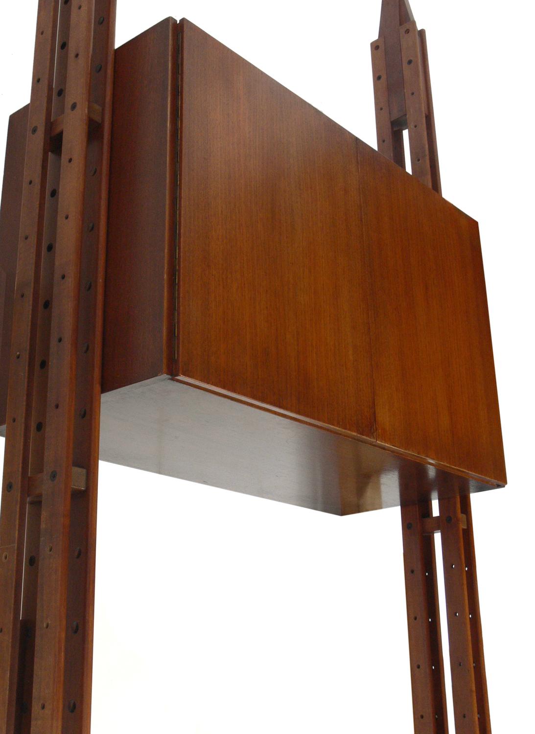 Modernist Italian bookcase, Model LB7, designed by Franco Albini for Poggi, Italy, circa 1950s. Signed Poggi on feet. This library is comprised of three uprights, seven shelves and two cabinets. This bookcase is currently being refinished and can be