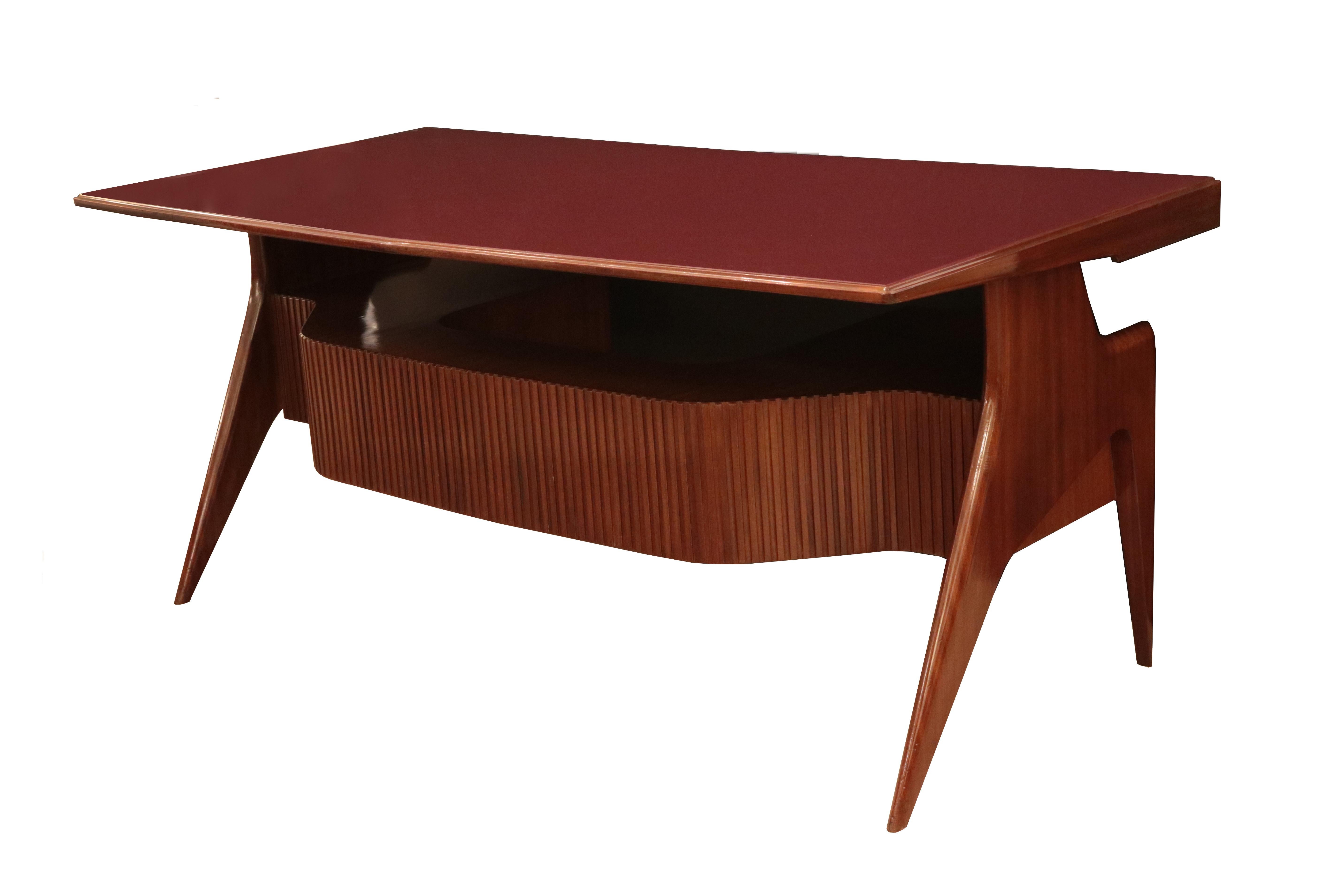 An Italian modernist desk.
Mahogany with glass top.
  