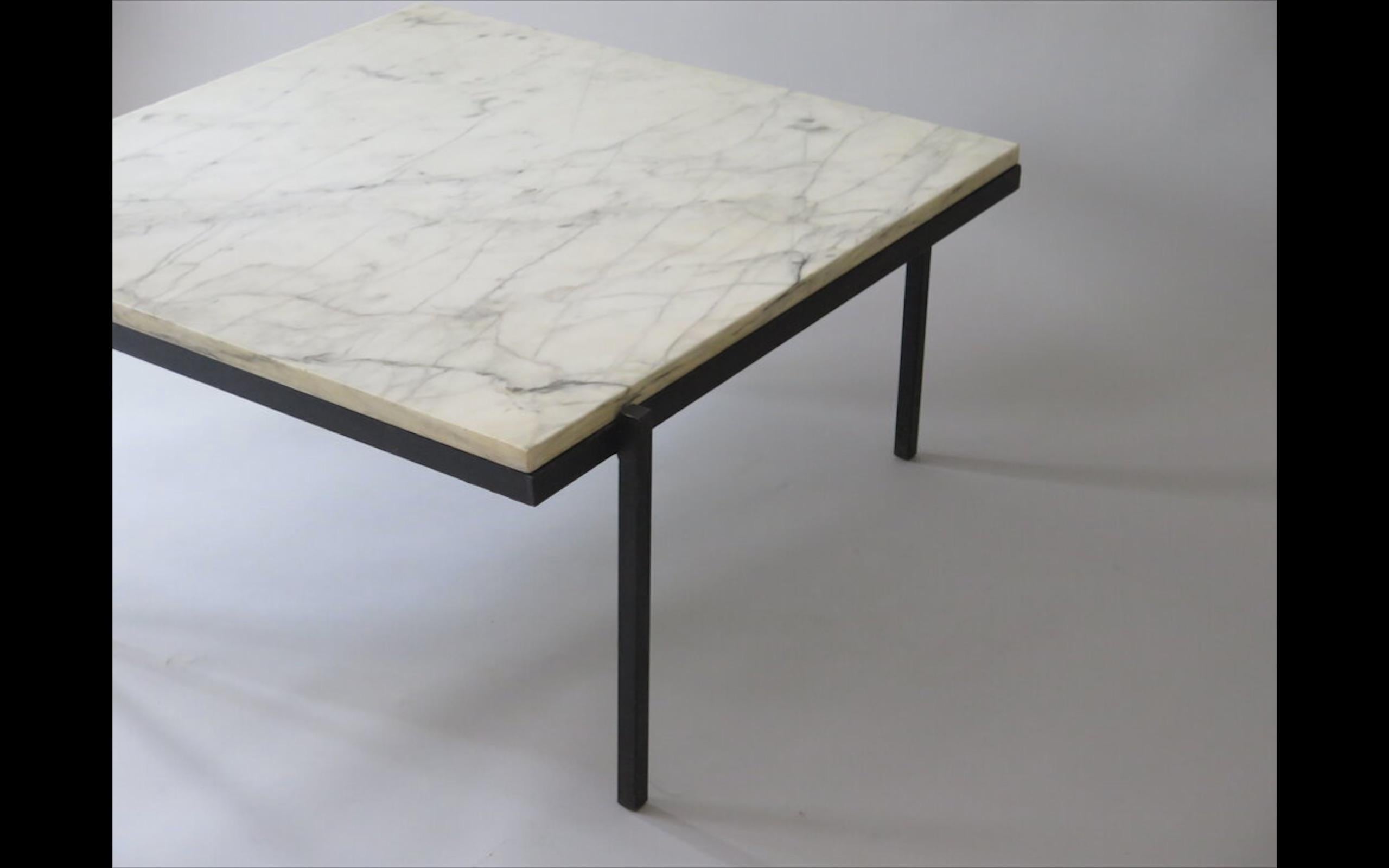 Modernist marble and iron coffee table with Italian marble top, circa 1950. In the style of Poul Kjærholm. ‘Italy’ etched in charcoal on the bottom of the beautifully veined marble top.