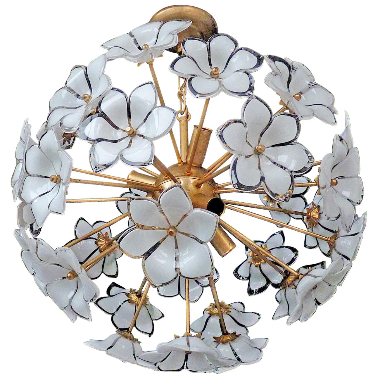 Vintage midcentury Italian Murano flower bouquet attributed to Venini. Art-glass with hand blown white and clear art glass flowers and gilt brass. Pair also available.
Measures:
Diameter 20 in/ 50 cm
Height 27.5 in (chain=70 cm
Weight 16 lb/7 Kg
6