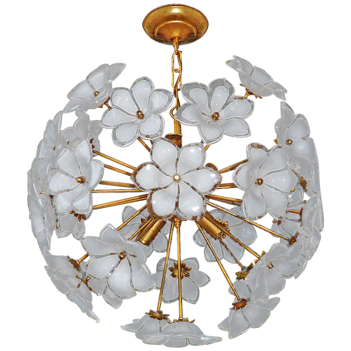 Vintage midcentury Italian Murano flower bouquet in the style of Venini. Art-glass with hand blown white and clear art glass flowers and gilt brass. Pair also available.
Measures:
Diameter 20 in/ 50 cm
Height 27.5 in (chain=70 cm
Weight 16 lb/7 Kg
6
