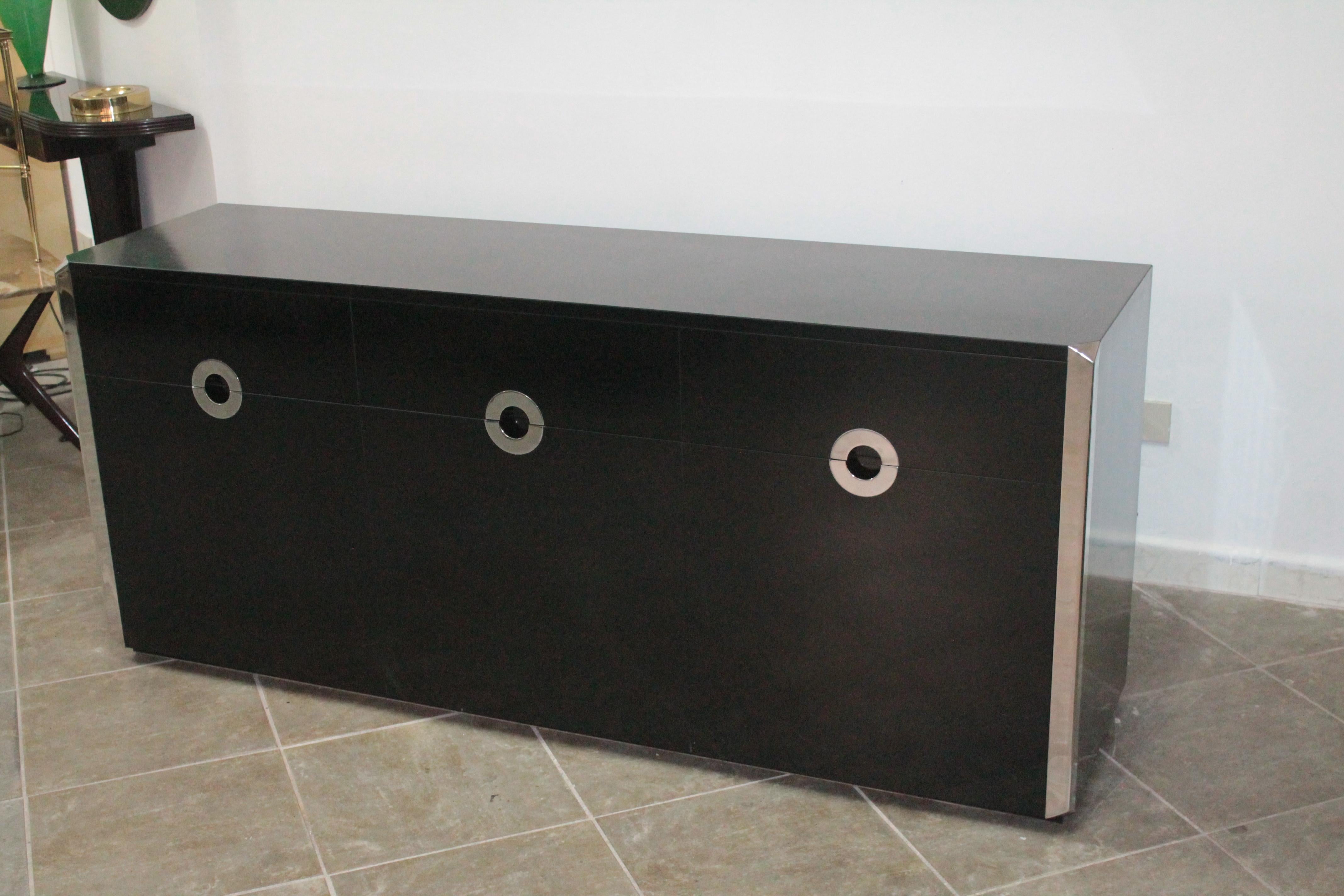 Italian sideboard 1970s Willy Rizzo for Mario Sabot, Italy. Box-shaped wood construction, the front with three drawers and three doors, Resopal coating, black, chromium plated metal. Measures: Height c. 75.5 cm, Width c. 177 cm, Depth c. 47.5 cm.