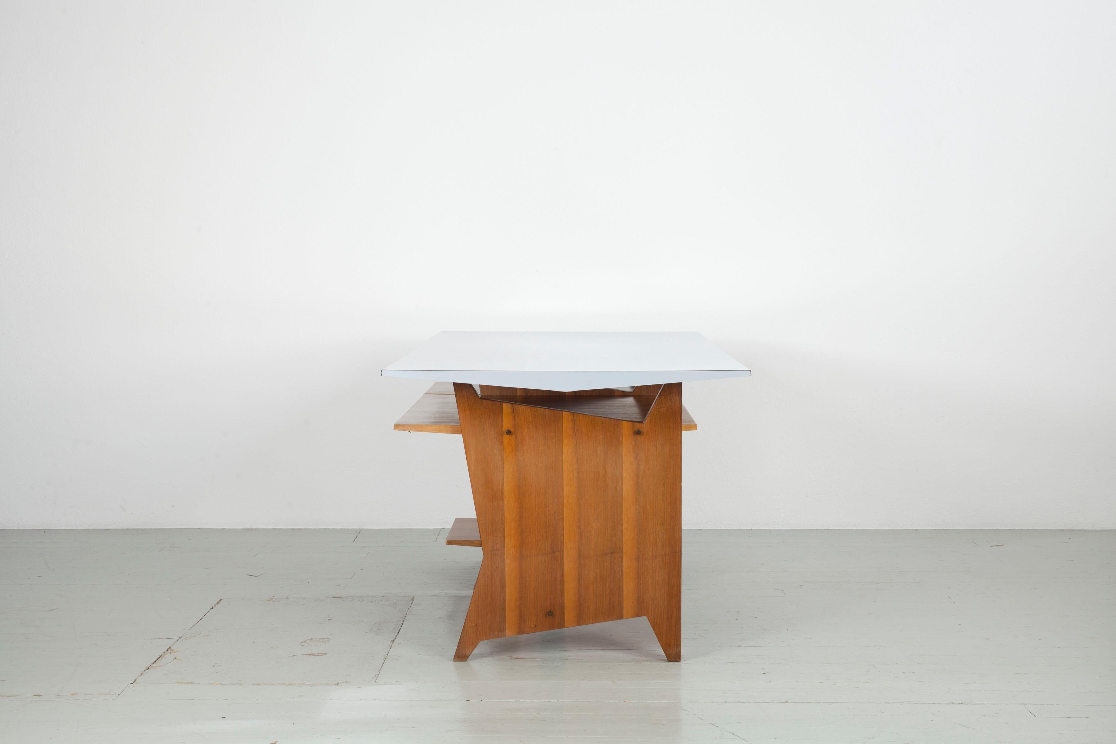 Italian Modernist Italien writing desk with drawers and light blue Formica table top.  For Sale