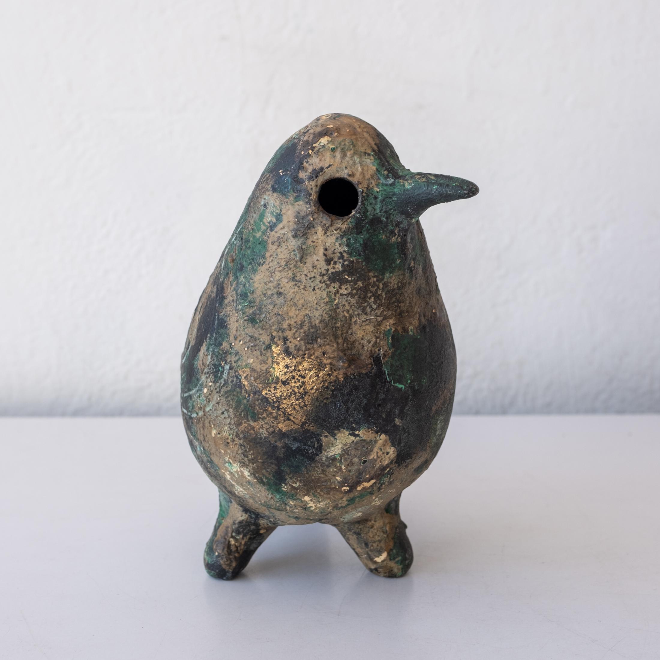 Stylized cast iron bird sculpture from Japan. Fantastic incised design. Nice patina throughout. Stamped JAPAN. 1950s