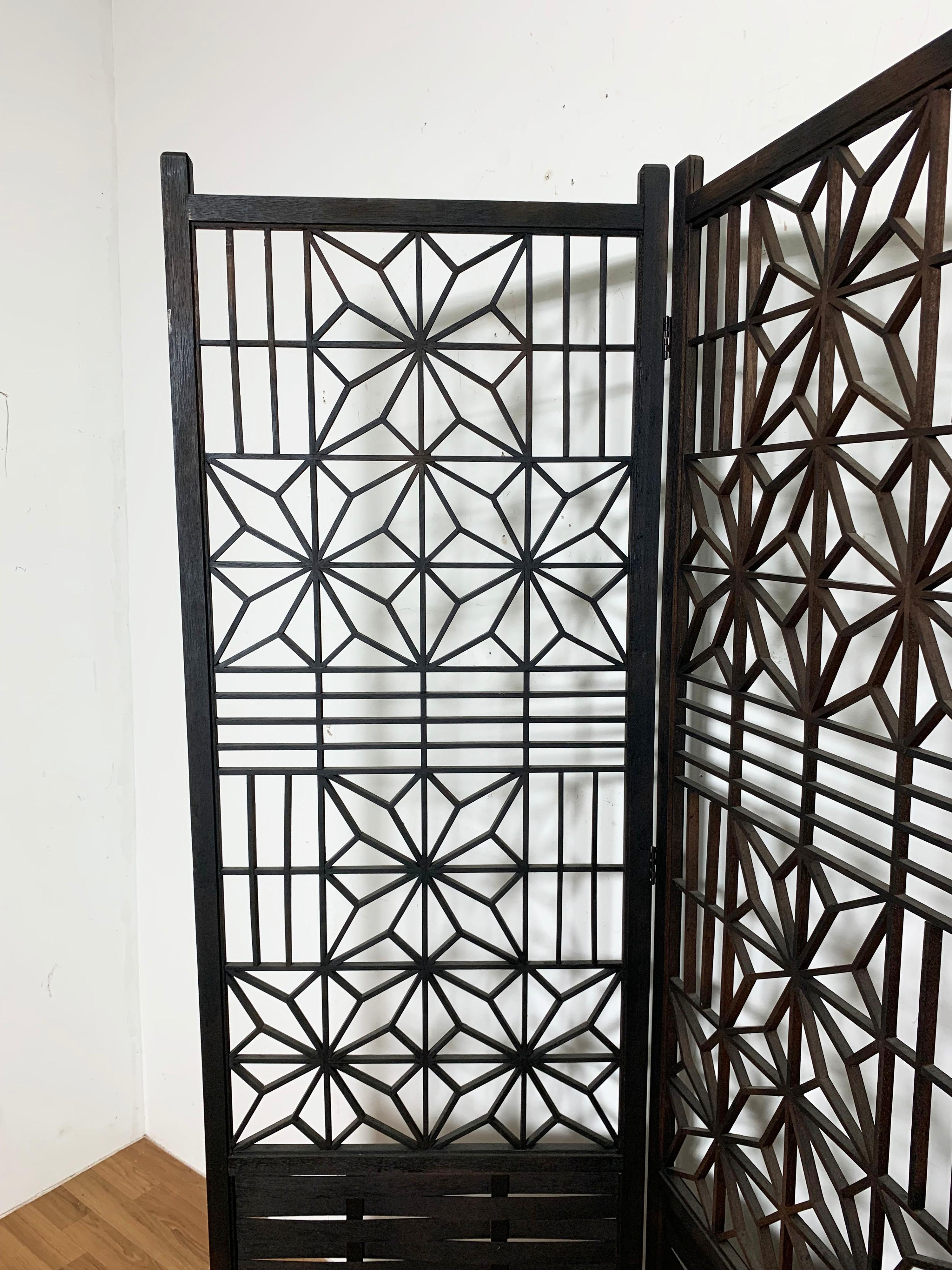 A fine, lace-like Japanese four panel kumiko screen in ebonized cedar, ca. 1950s.

Each panel measures 71.5