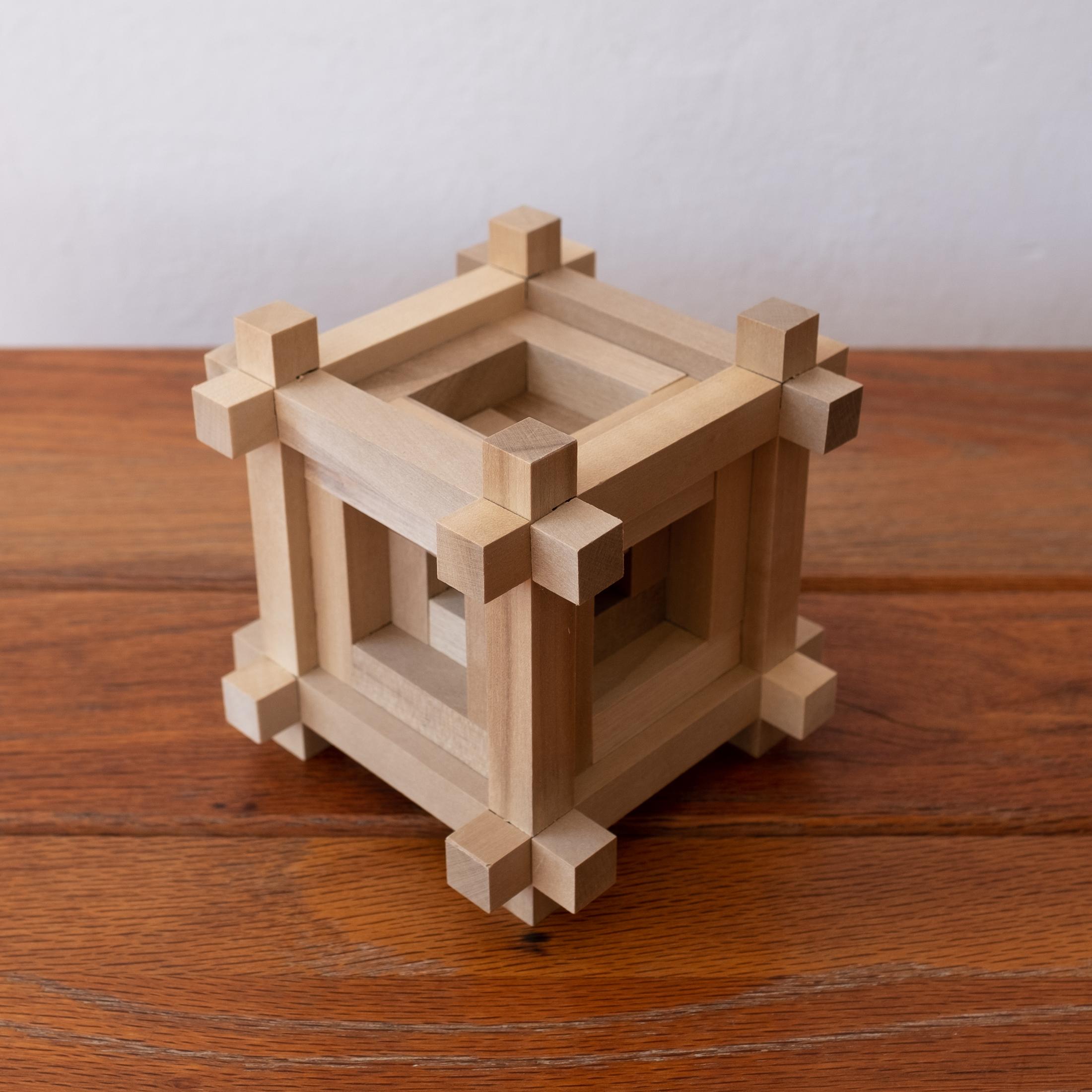 Wood puzzle sculpture by Sori Yanagi for Kumiki. Yanagi designed just a few puzzles for the company. Includes original box and paperwork, Japan, 1960s

Sori was the son of the Japanese Folk Crafts Museum founder, Soetsu Yanagi. Having studied both