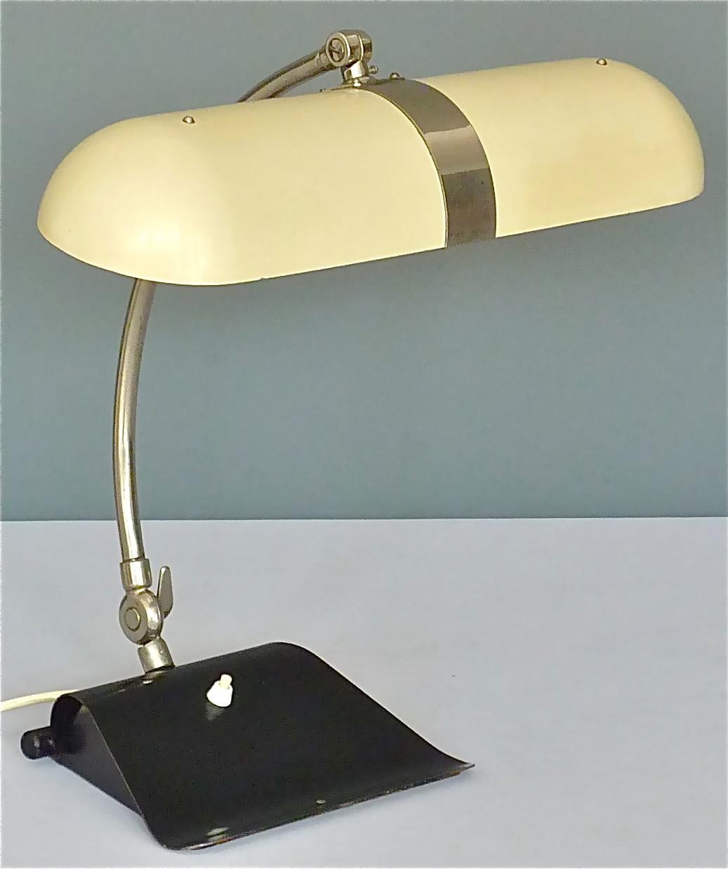 Exceptional and very rare early Kaiser neon tube table lamp which can be dated Germany around 1930-1940. This light has a good-weight black enameled metal base which is 23.5 cm / 9.25 inches wide and 20 cm / 7.87 inches deep, a nickeled brass