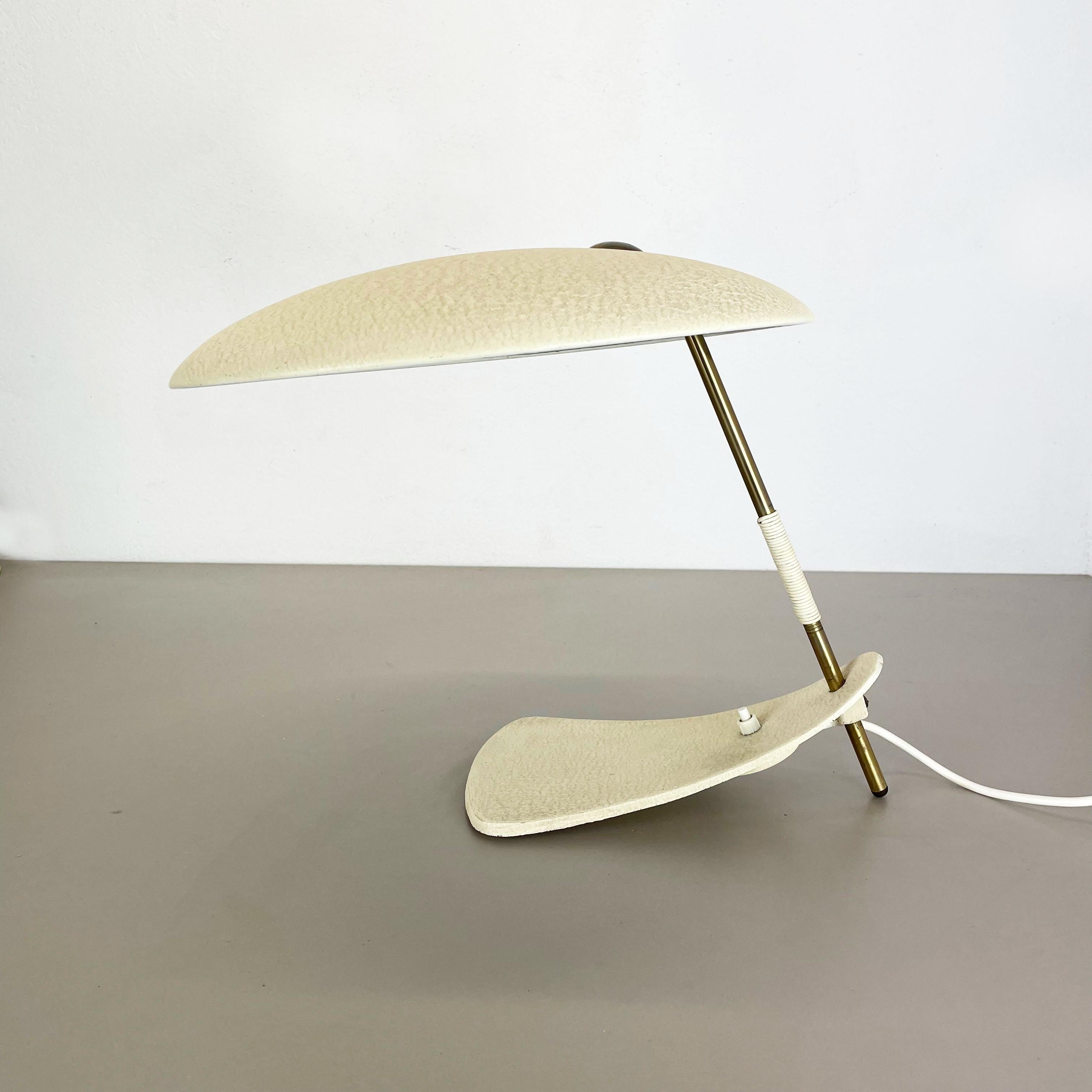 Article:

Desk light 


Origin:

Austria


Producer:

in style of J.T. Kalmar


Age:

1950s


Original Bauhaus Light, designed and produced in Austria in the 1950s. All original good and full working condition with patina. One of a kind design