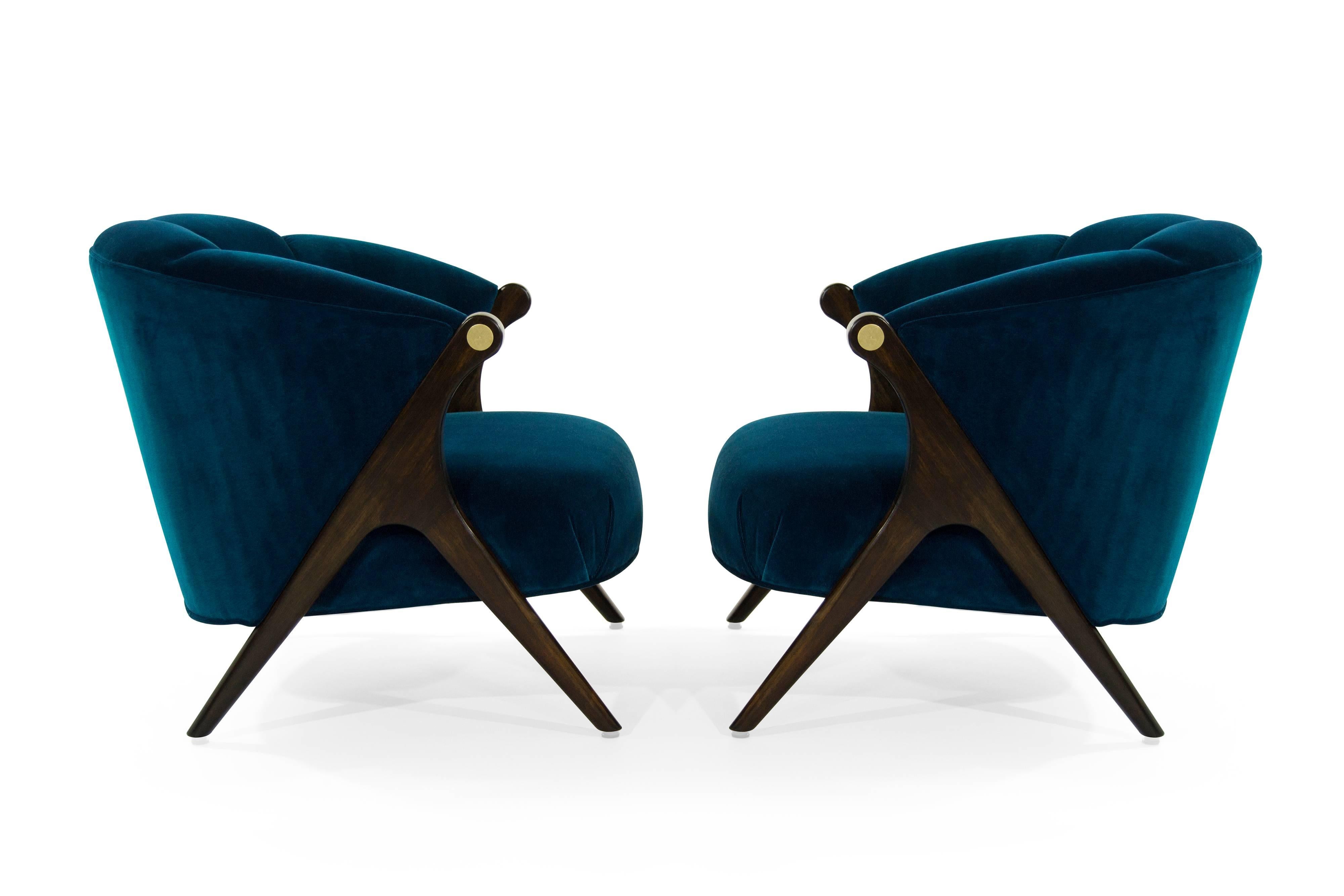 Pair of lounge chairs designed by Karpen of California, circa 1950s.

Walnut legs fully restored, brass accents on arms newly polished, Newly upholstered in aqua plush velvet by Holly Hunt.