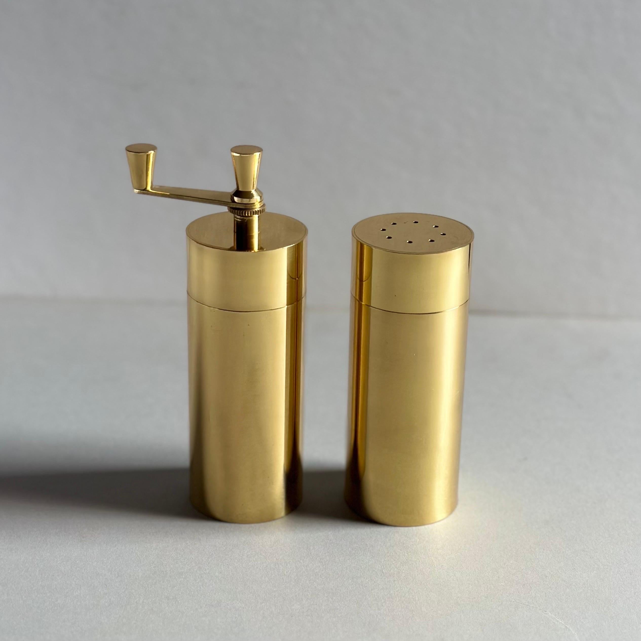 An exceptional quality, modernist salt and pepper set executed in lacquered, solid brass, made in Italy. In impeccable, unused condition and with original presentation box labeled, 