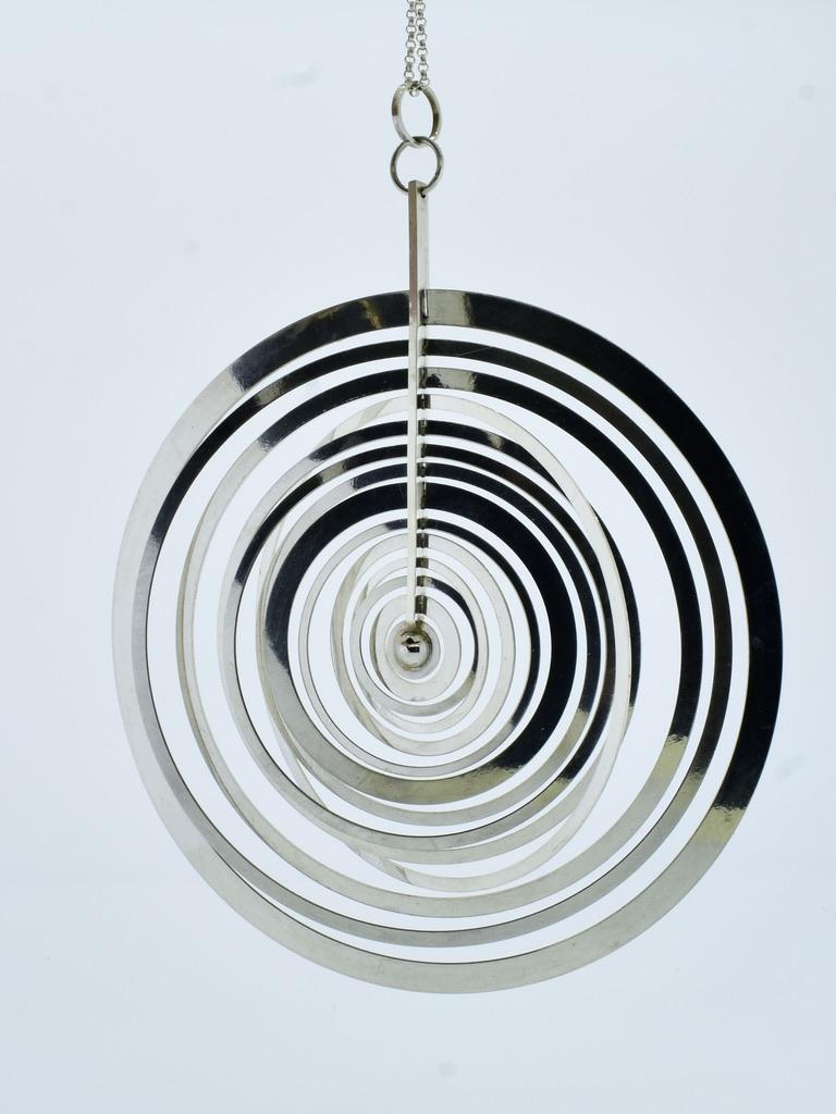 Tapio Wirkkala has designed an unusual Modernist pendant called the Hopeakuu or Silver Moon. It was manufactured by Nils Westerback, Helsinki, Finland. This is the largest version made by Tapio Wirkkala and very difficult to find today. Composed of